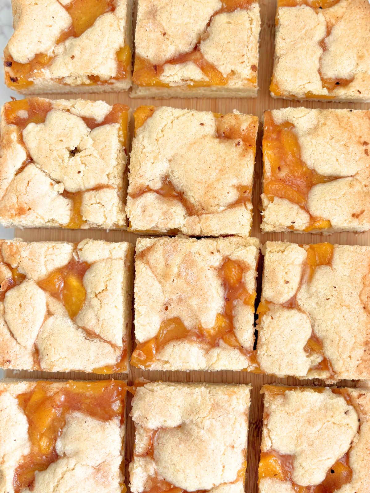 peach pie cookie bars on a tray