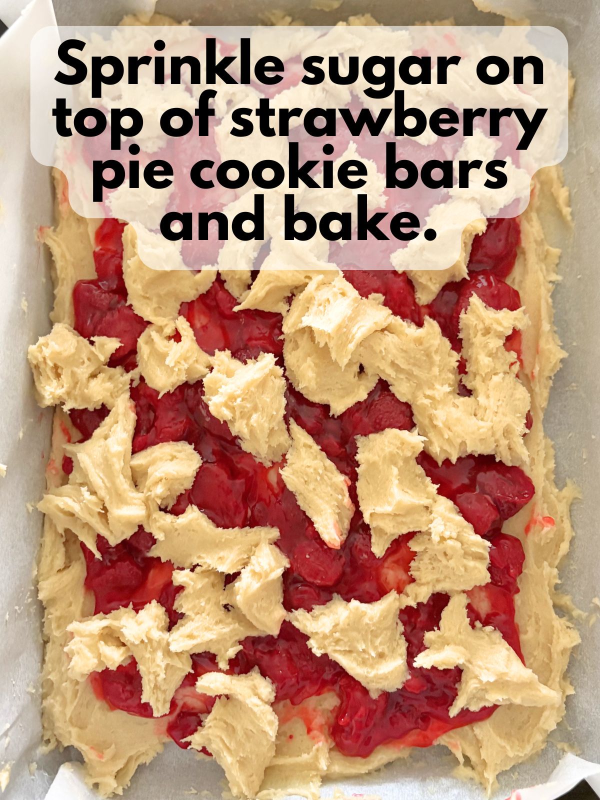 sugar sprinkled on top of unbaked strawberry pie cookie bars