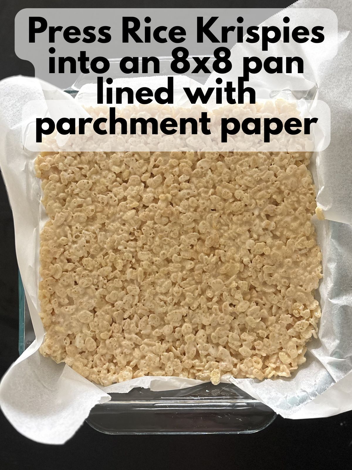 rice krispie treats pressed into a square pan