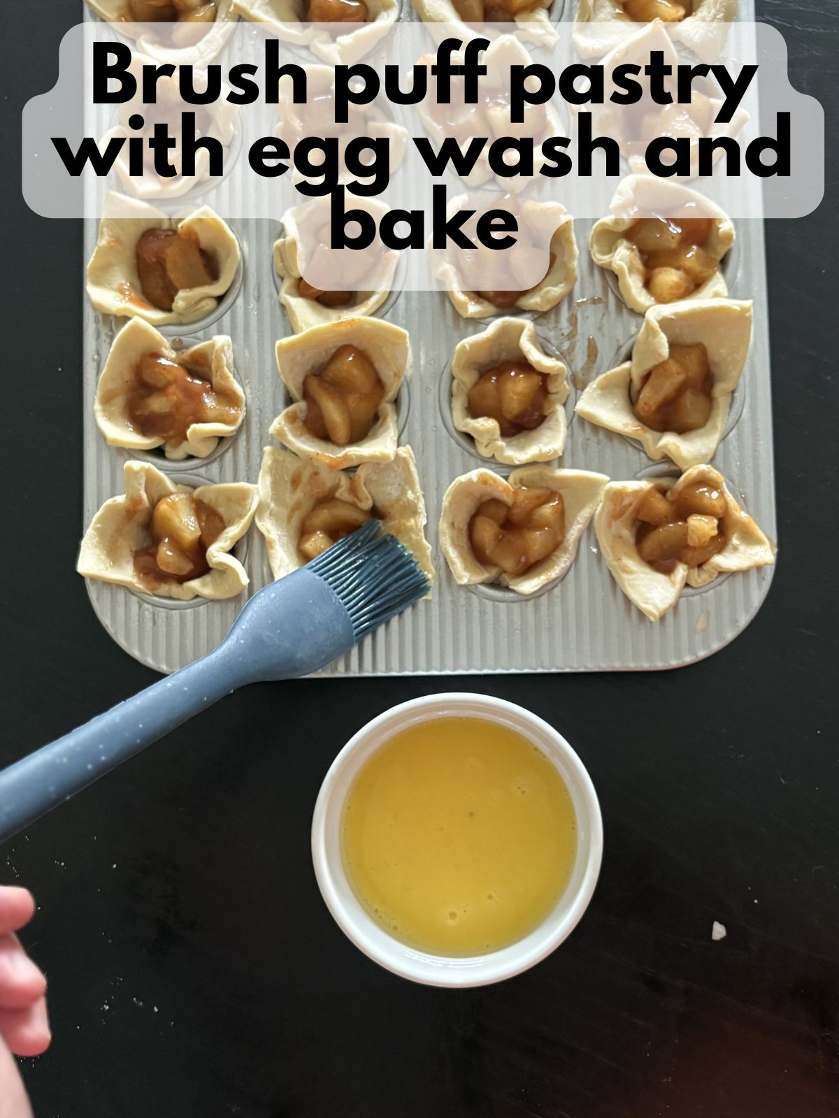 egg wash being brushed onto puff pastry