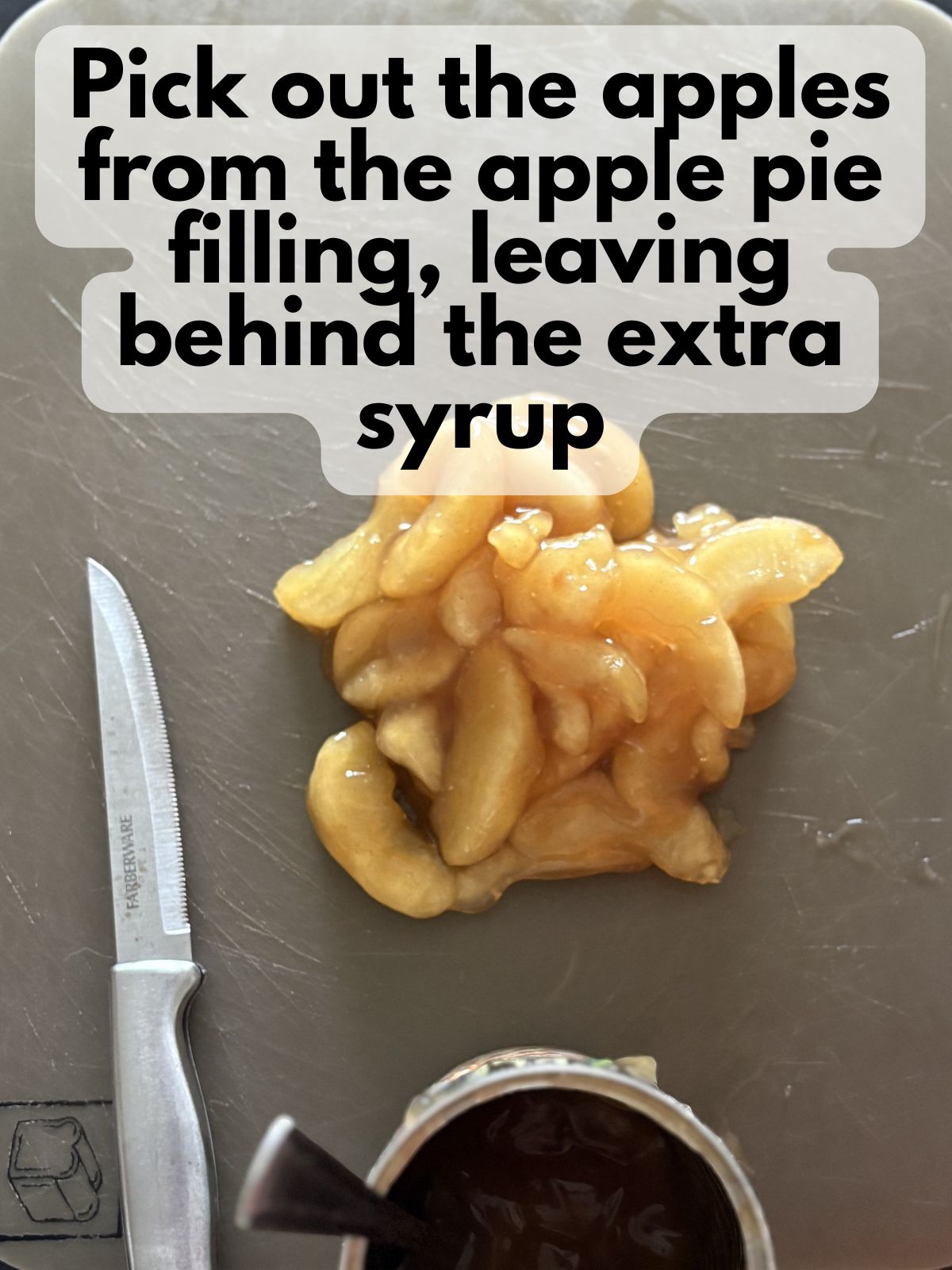 apples from apple pie filling on a cutting board, most of the syrup from the apple pie filling remains in the can