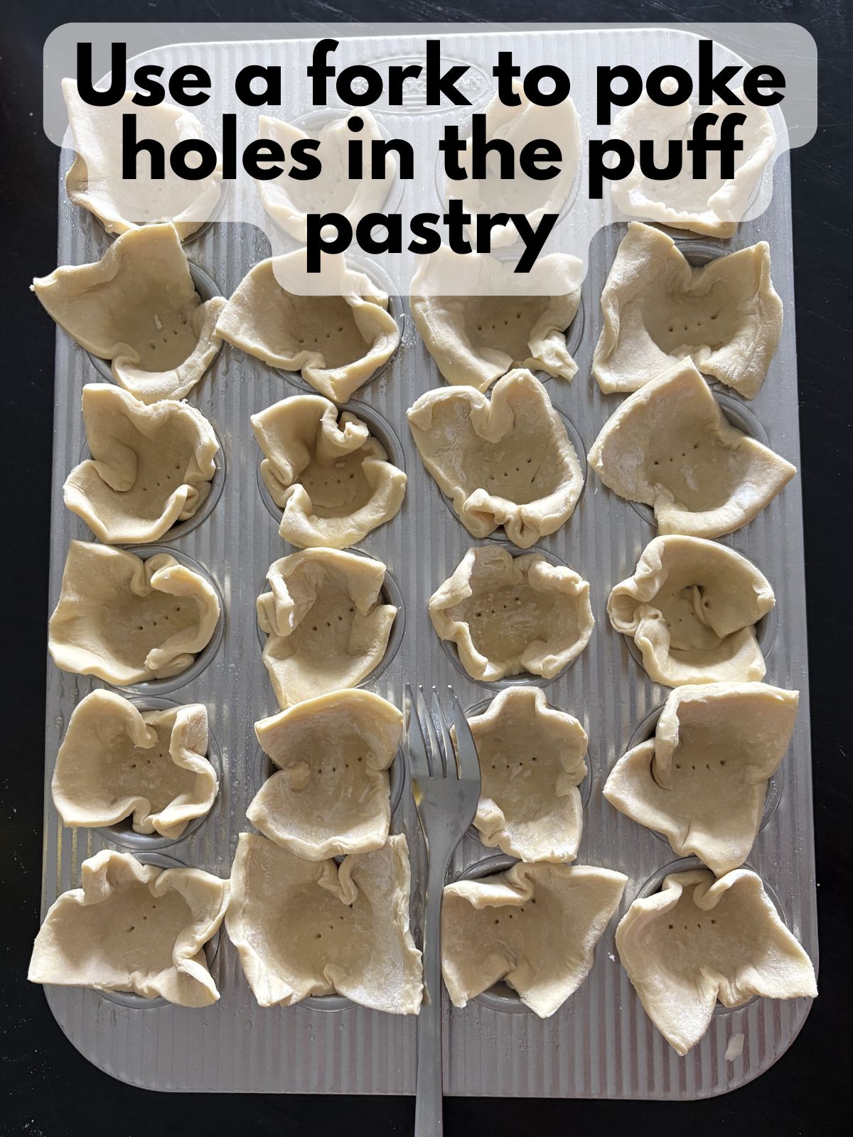 holes poked in puff pastry with a fork