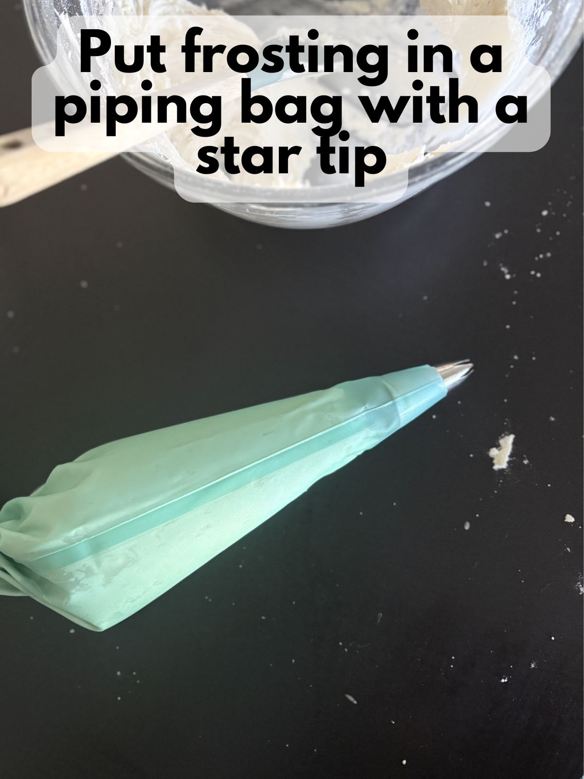vanilla buttercream in a piping bag with a star tip
