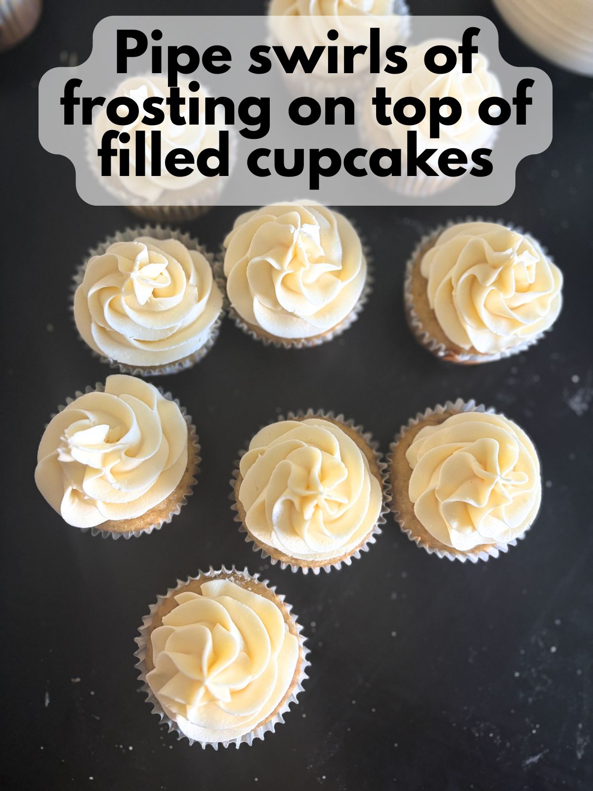 vanilla buttercream on top of banana pudding cupcakes
