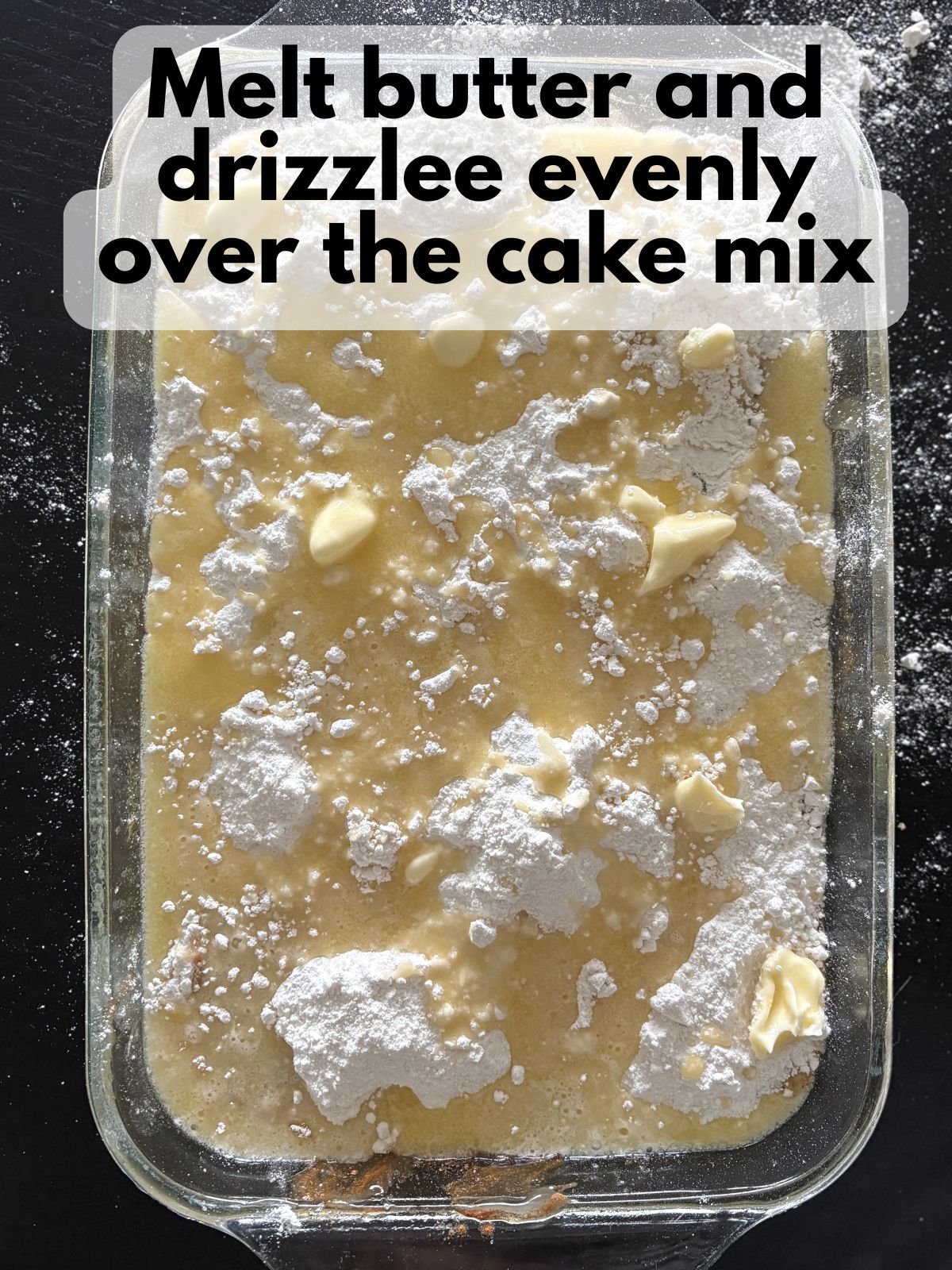 butter drizzled over cake mix over apple pie filling