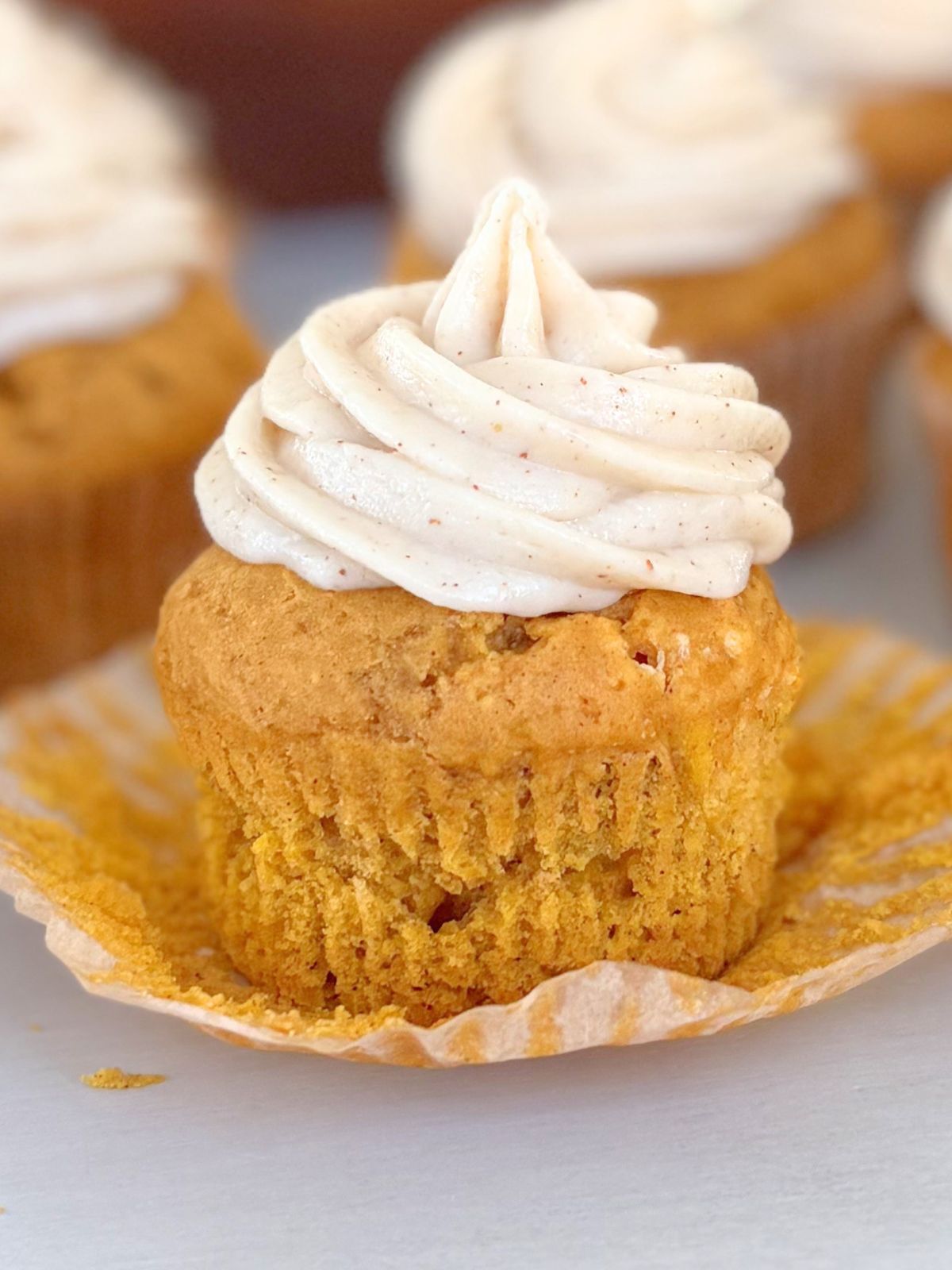 gluten free pumpkin cupcake with brown butter maple frosting