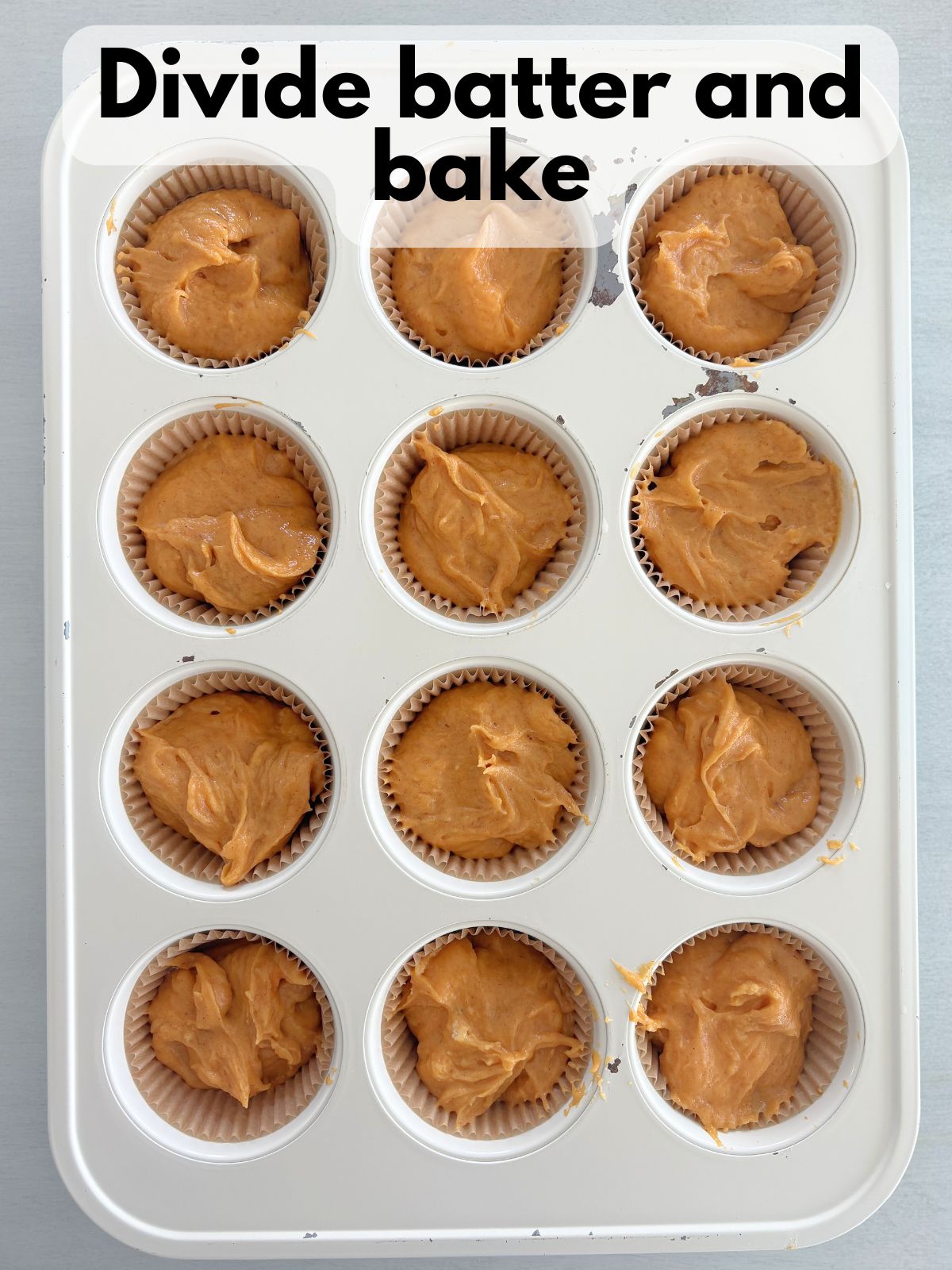 gluten free pumpkin cupcake batter in a cupcake tin