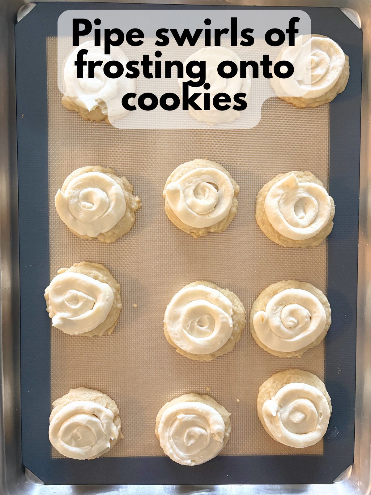 vanilla buttercream piped on top of sugar cookies