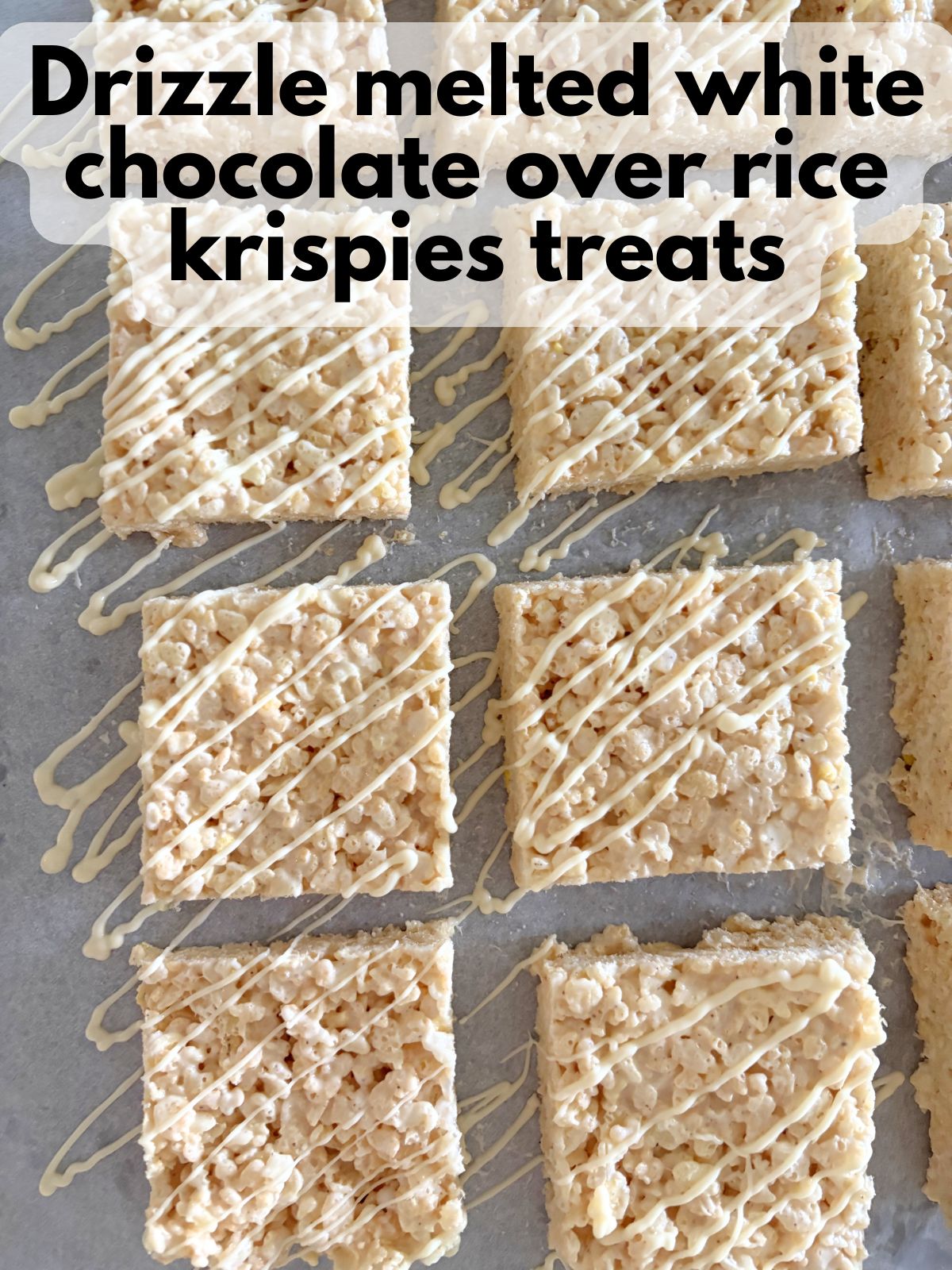 white chocolate drizzled over sheet pan rice krispie treats