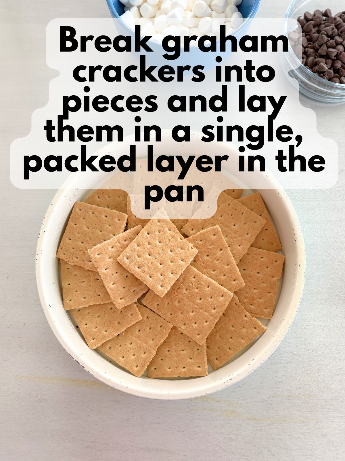 graham crackers spread in a single layer in a round pan