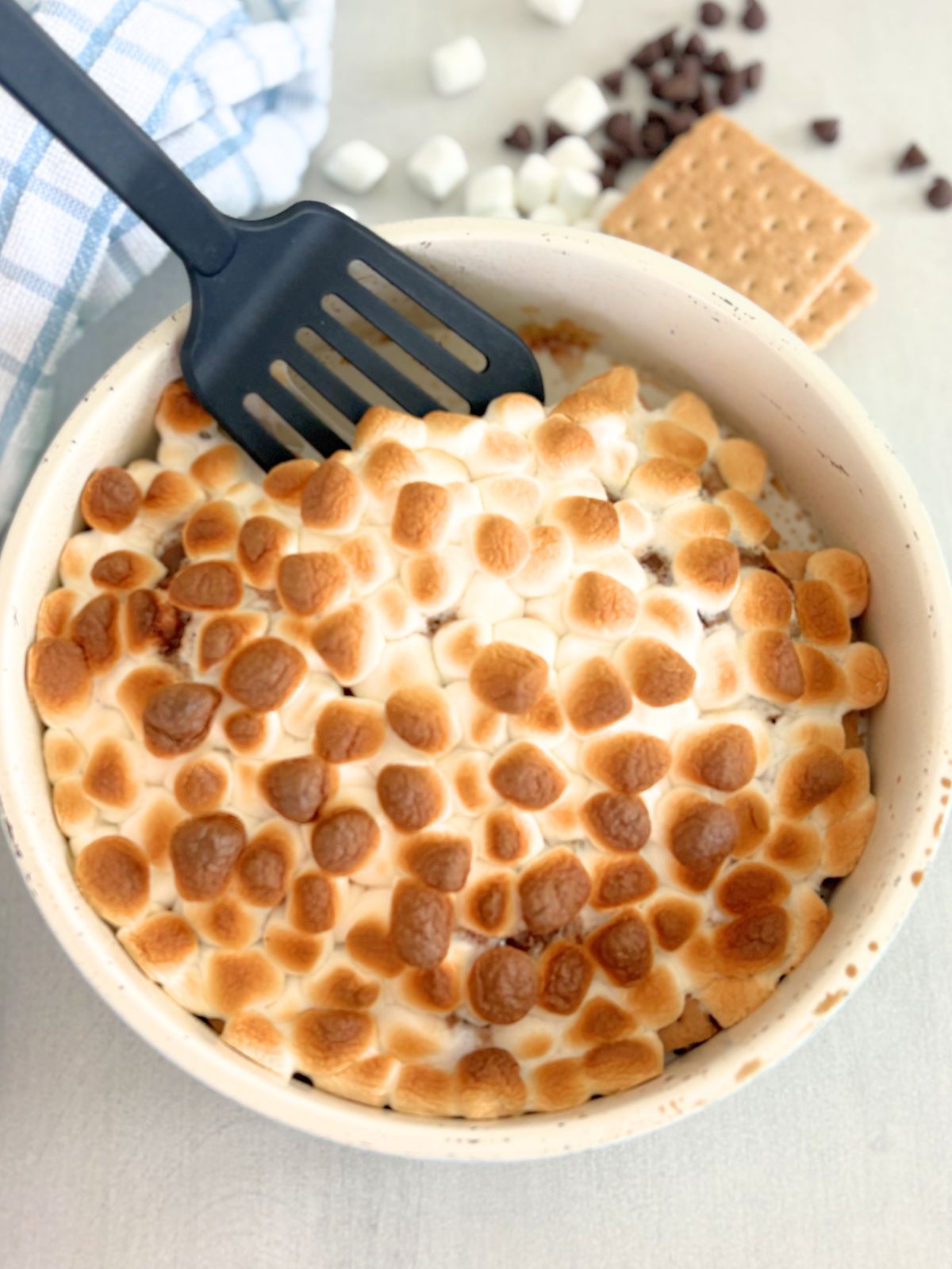 smores nachos in a pan with a spatula