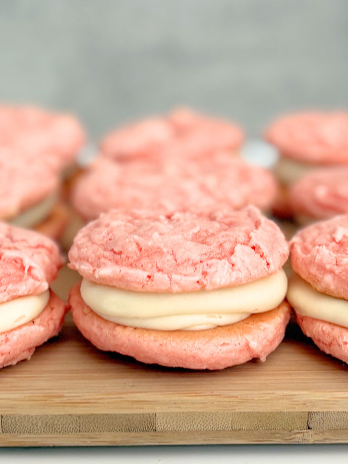 strawberry cake mix whoopie pies sitting on a tray