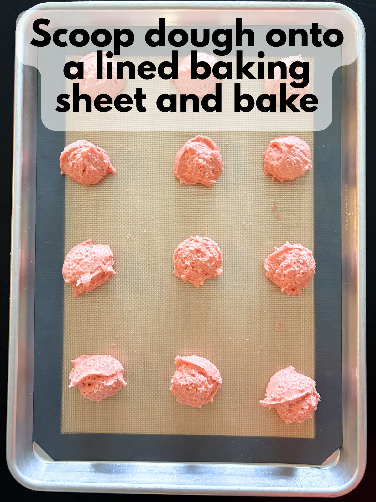 strawberry cake mix whoopie pie batter on a cookie sheet