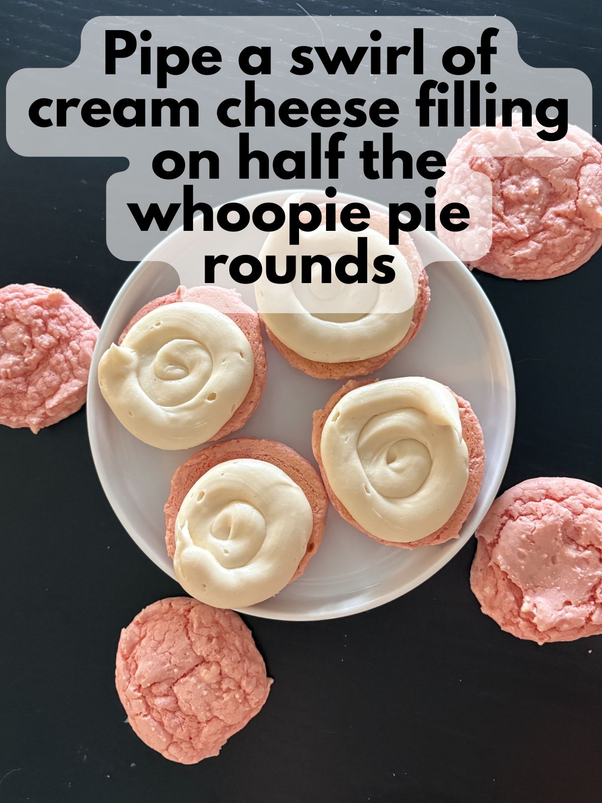 cream cheese filling piped onto whoopie pie rounds