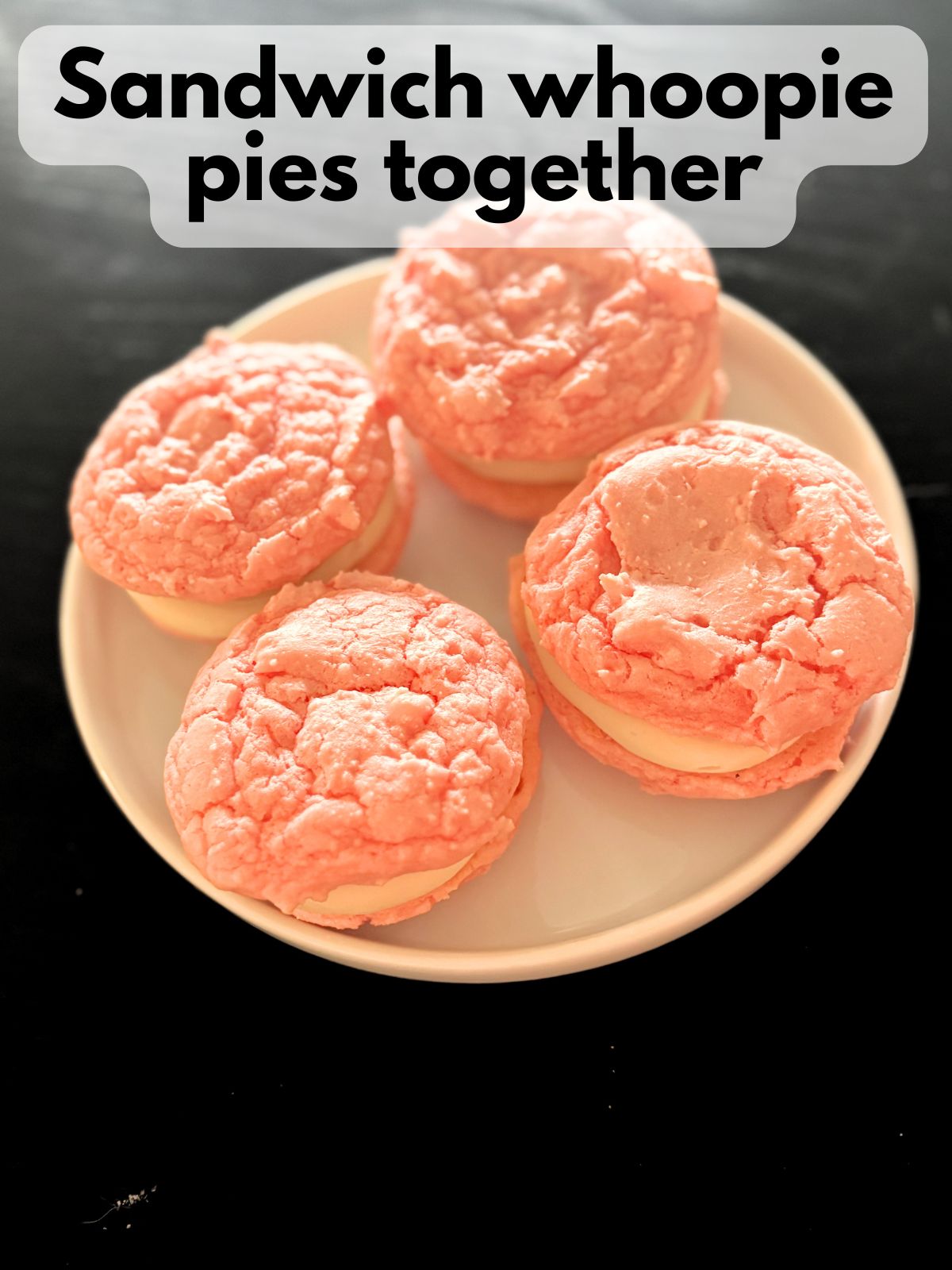 strawberry cake mix whoopie pies on a plate