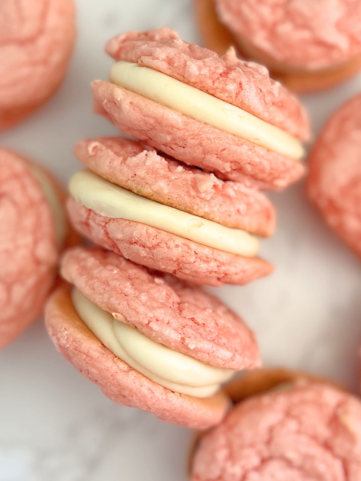 a stack of strawberry cake mix whoopie pies