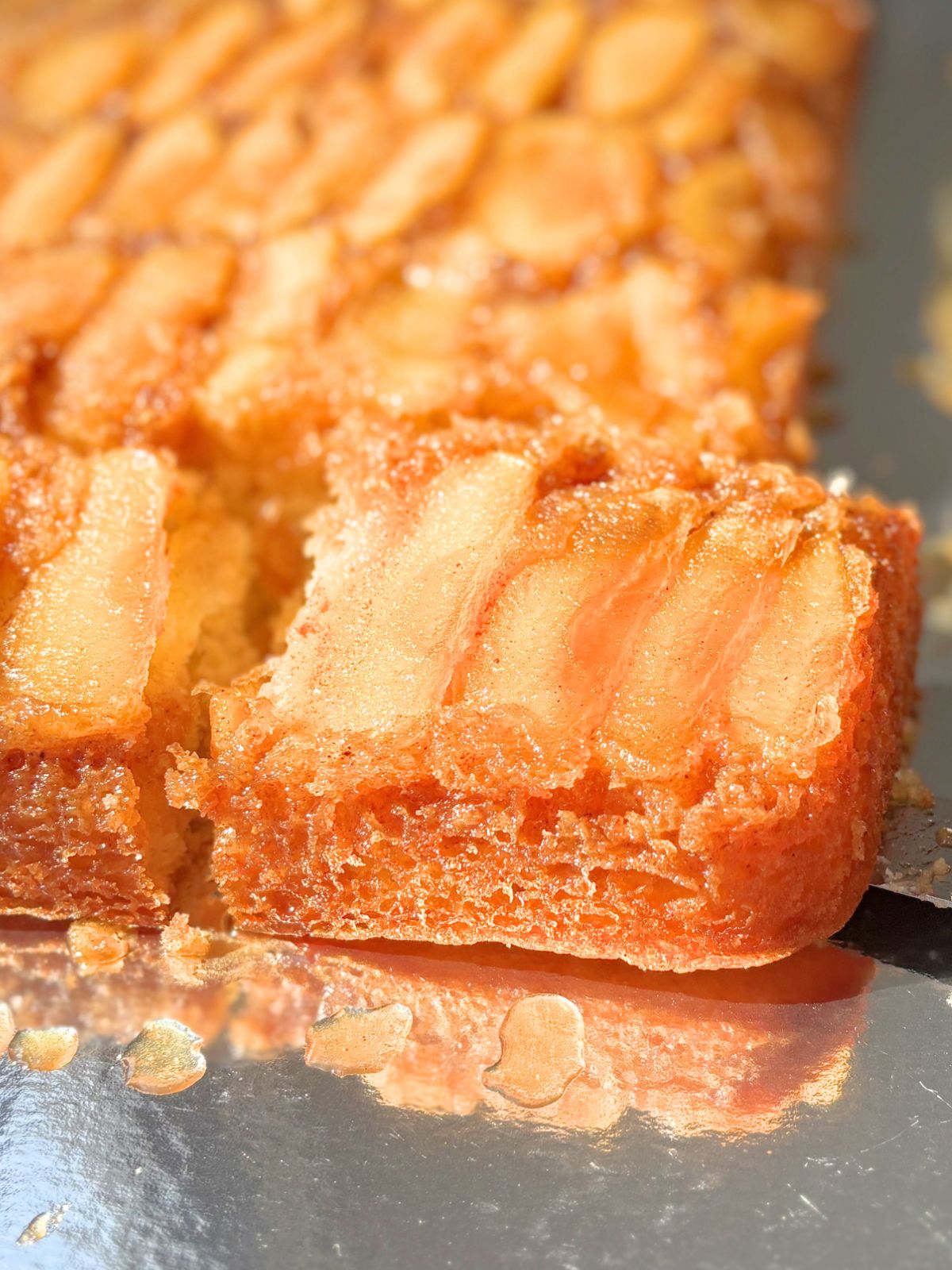 a slice of apple upside down cake
