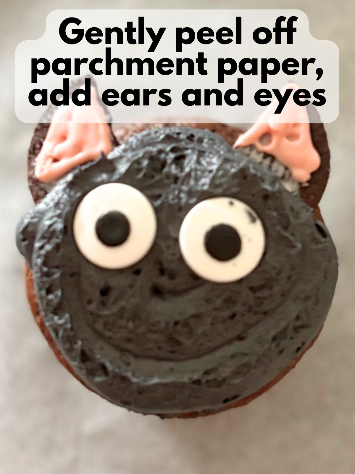 ears and eyes added to cat cupcake