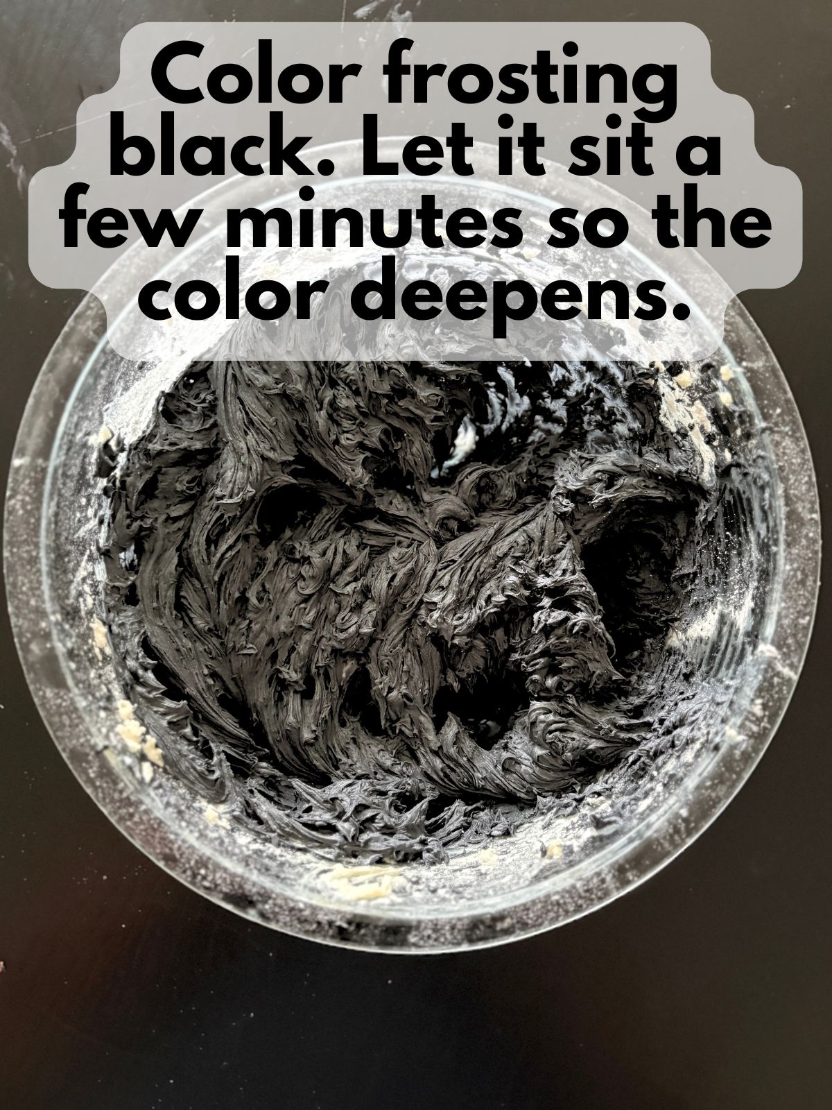 black buttercream in a mixing bowl