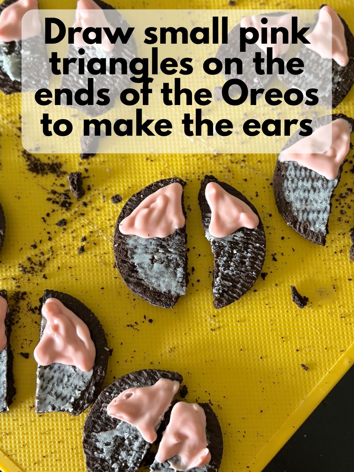 pink triangles drawn on oreo halves for cat ears
