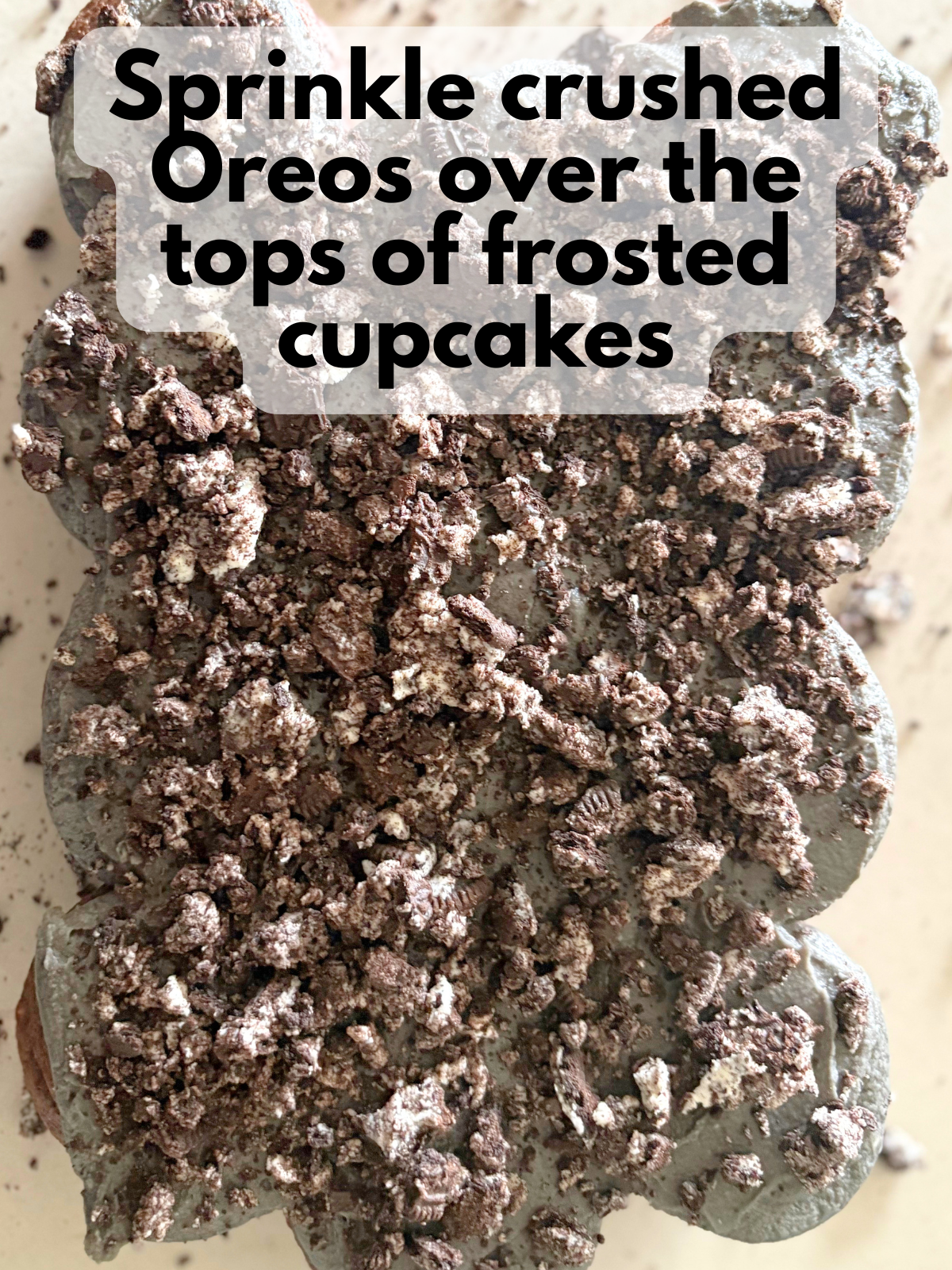crushed Oreos sprinkled over the top of cupcake cake