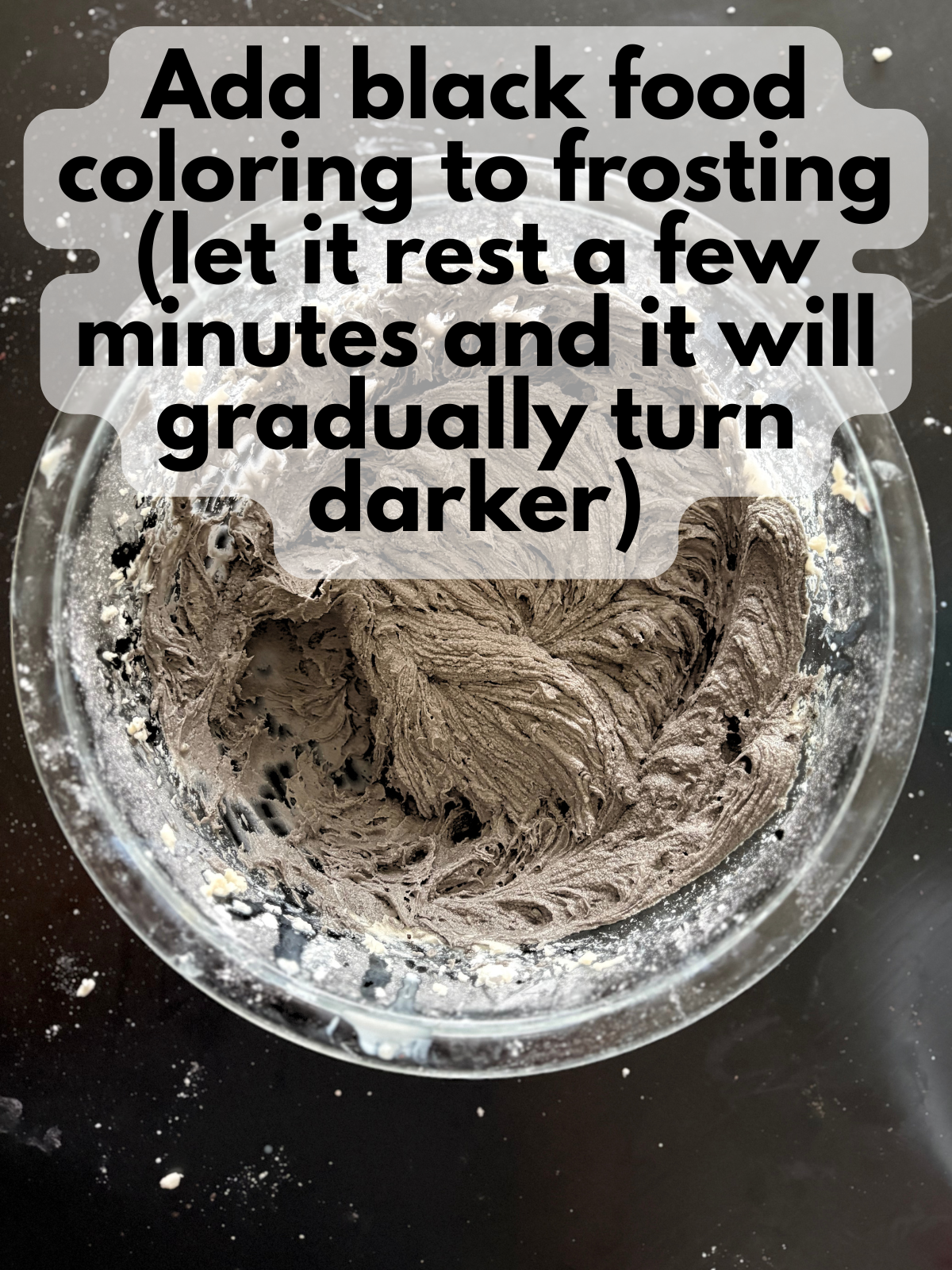 black buttercream frosting in a bowl