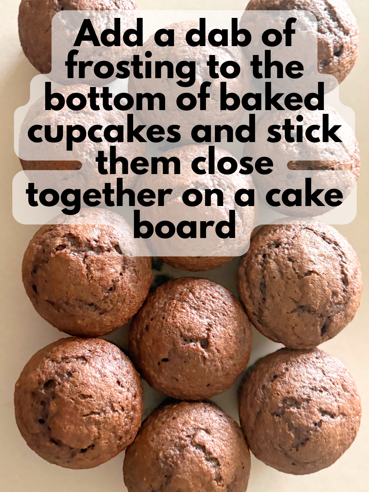 cupcakes stuck close together on a cake board