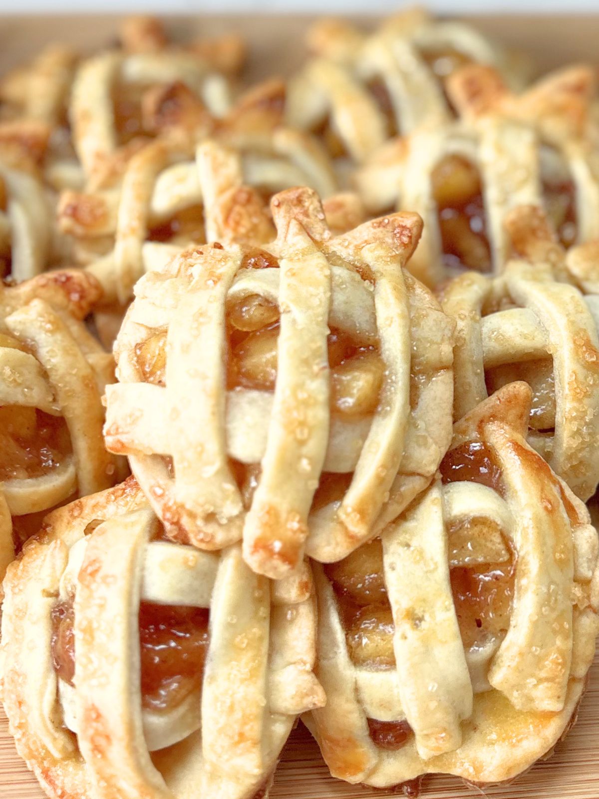 mini apple pies on a tray