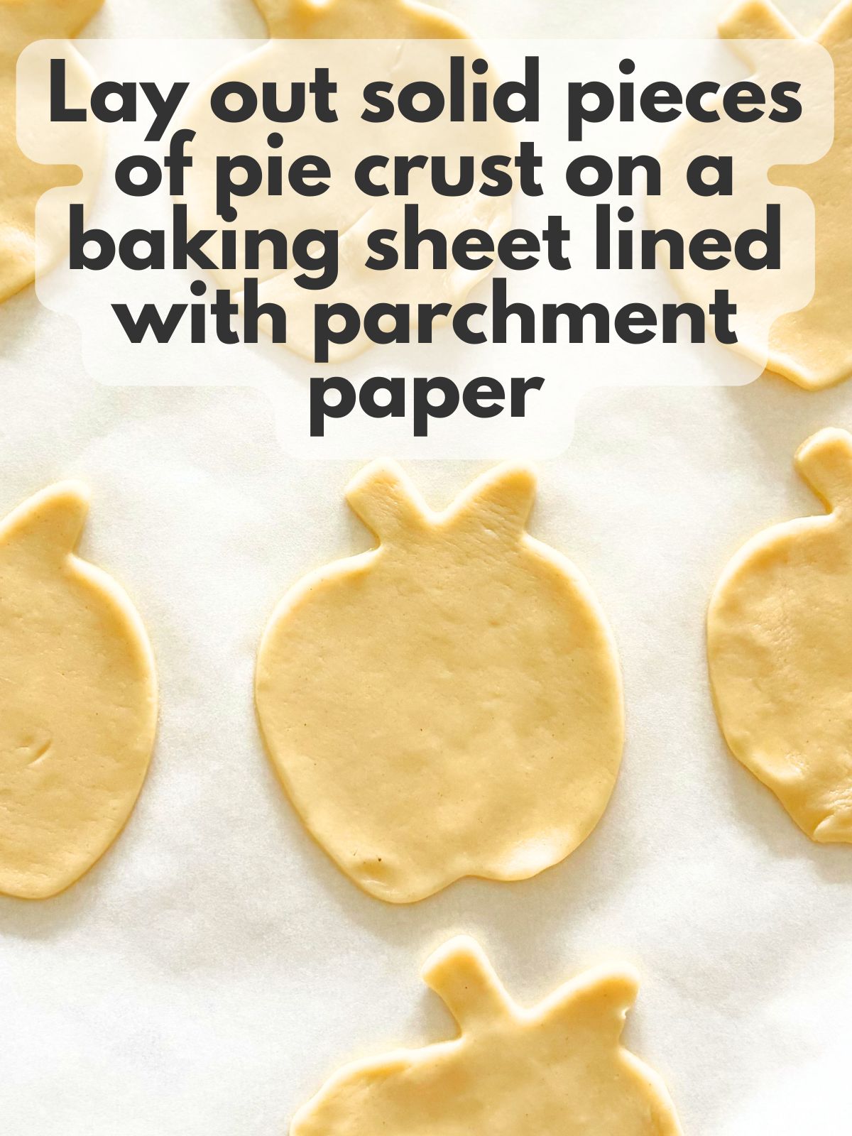 cut pie crust pieces on a baking sheet lined with parchment paper