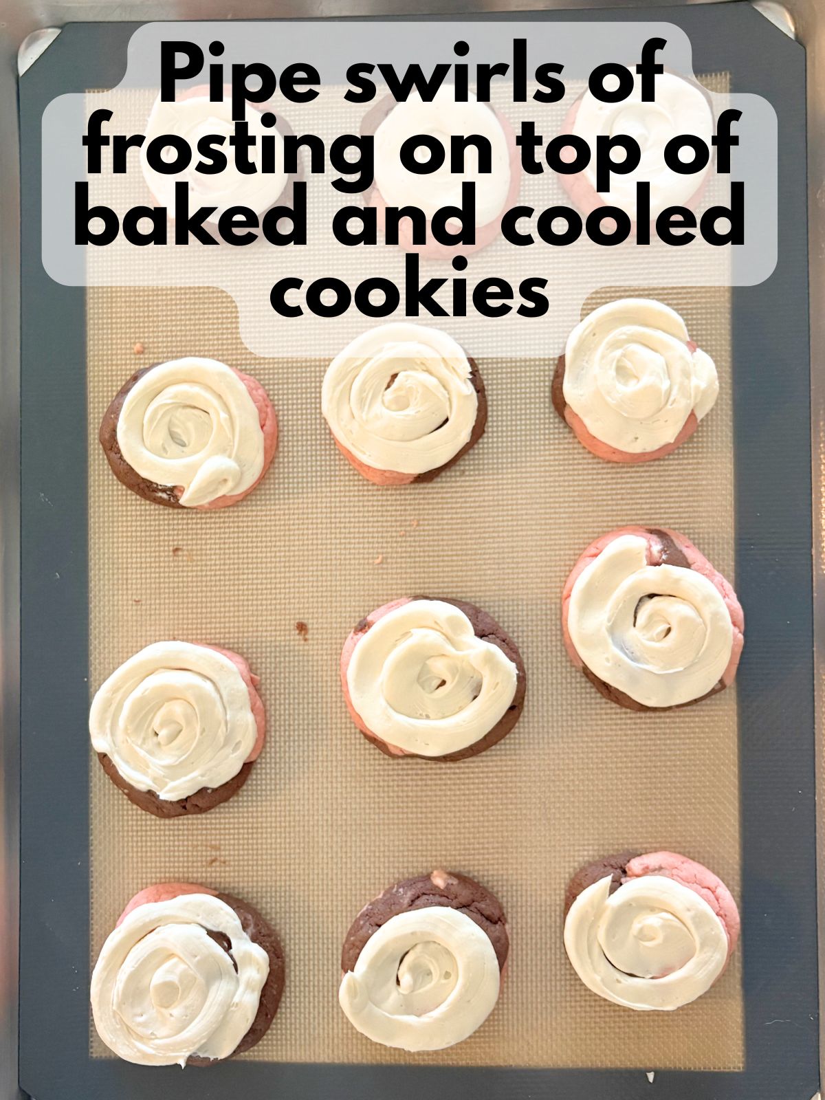 frosting piped on top of neapolitan cake mix cookies