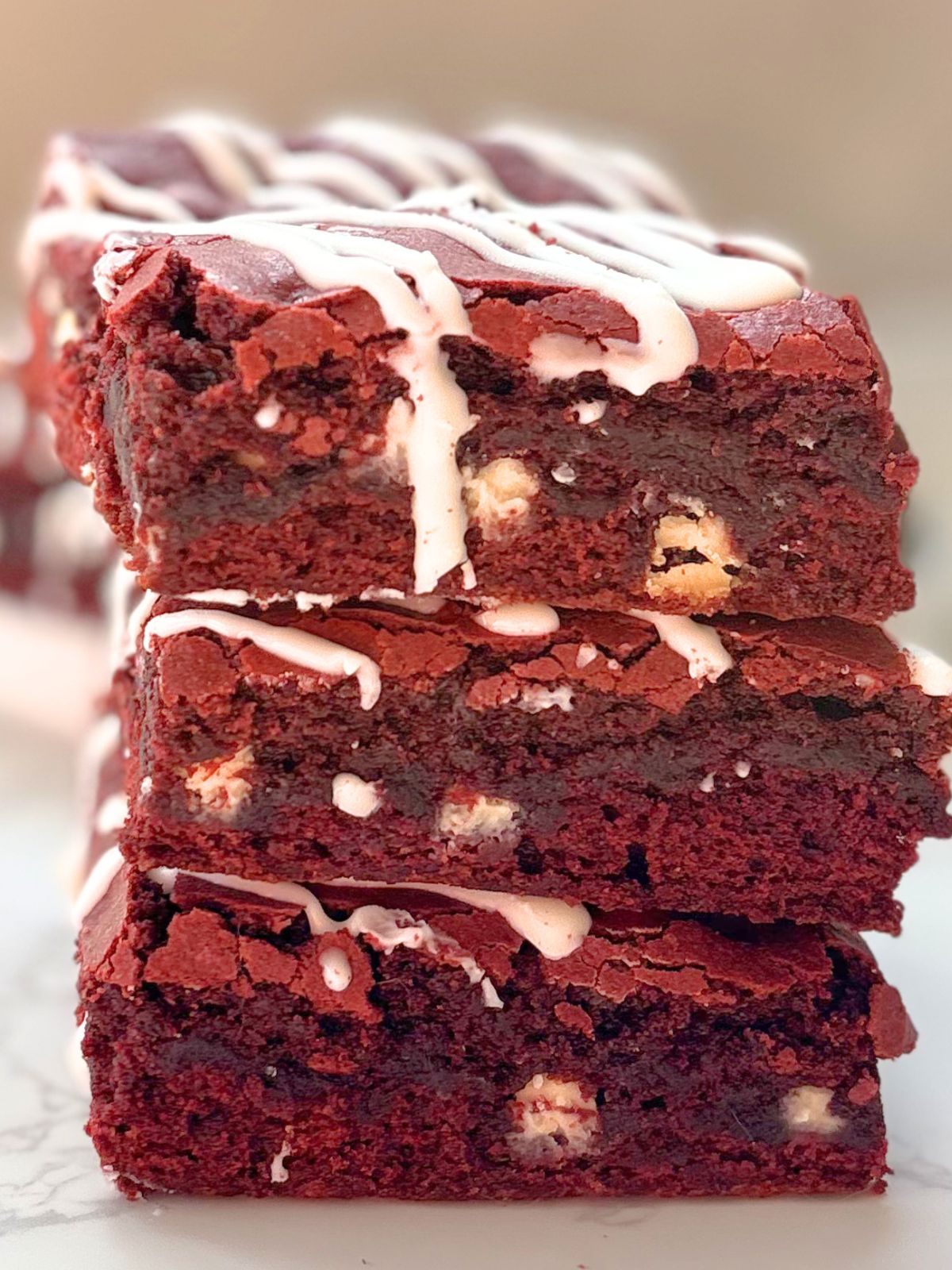 a stack of red velvet brownies