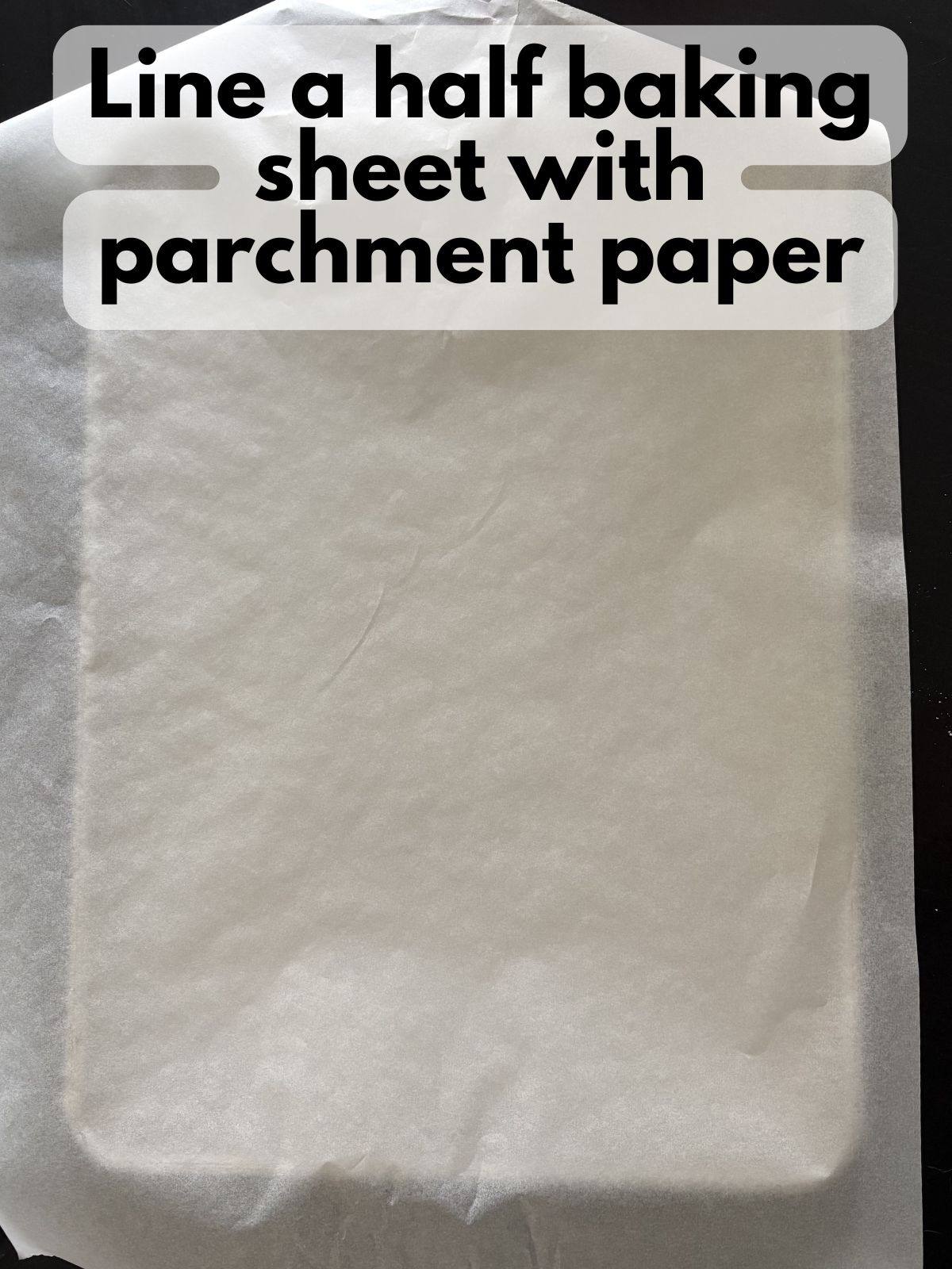 a half baking sheet lined with parchment paper