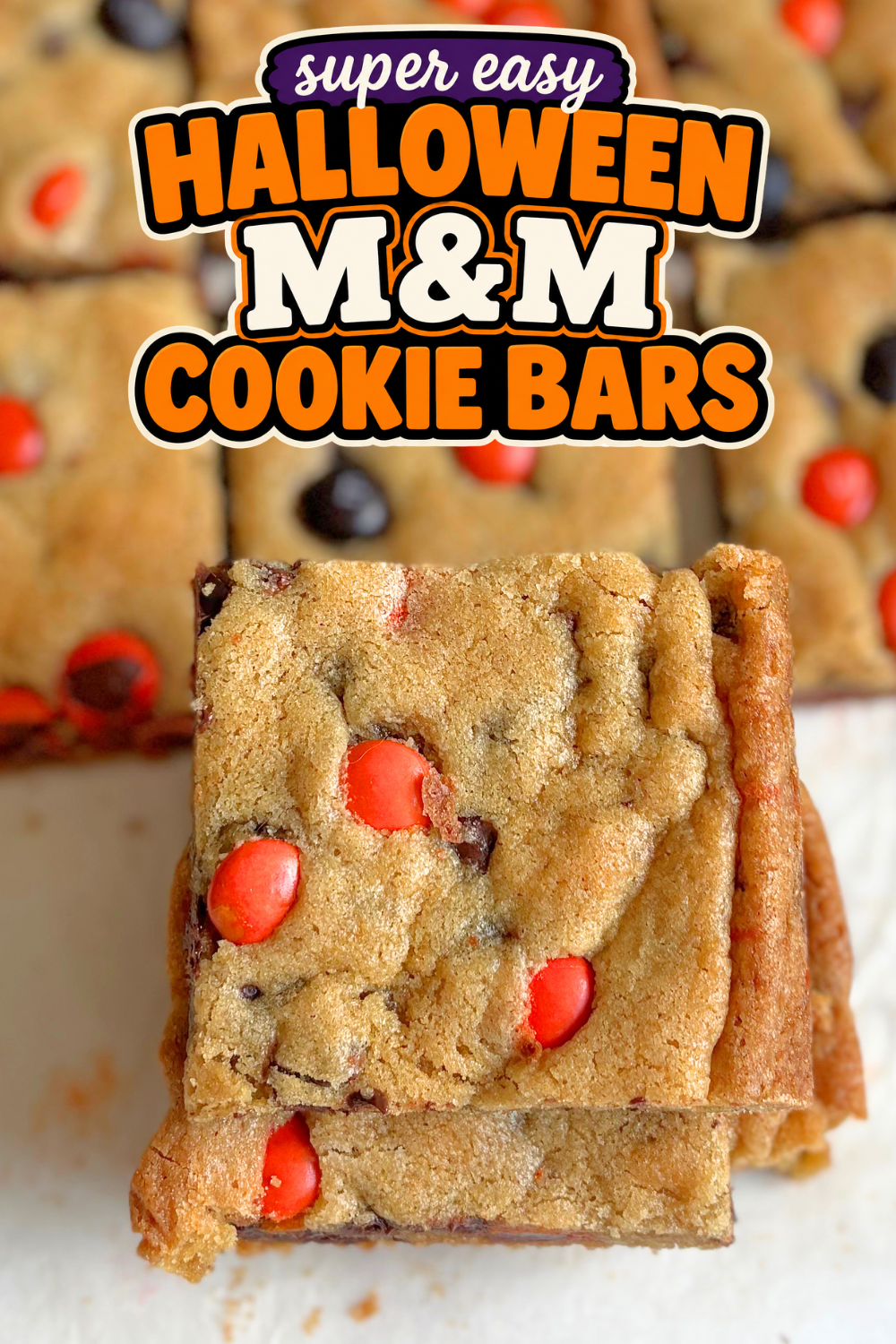 These soft and chewy Halloween M&M cookie bars are loaded with chocolate chips and colorful candy. An easy Halloween dessert for parties!