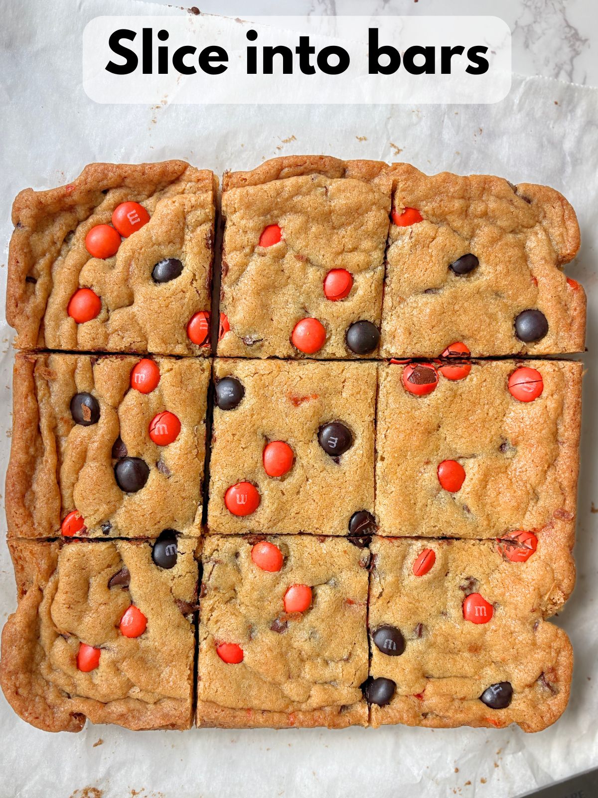 Halloween M&M cookie bars sliced into bars