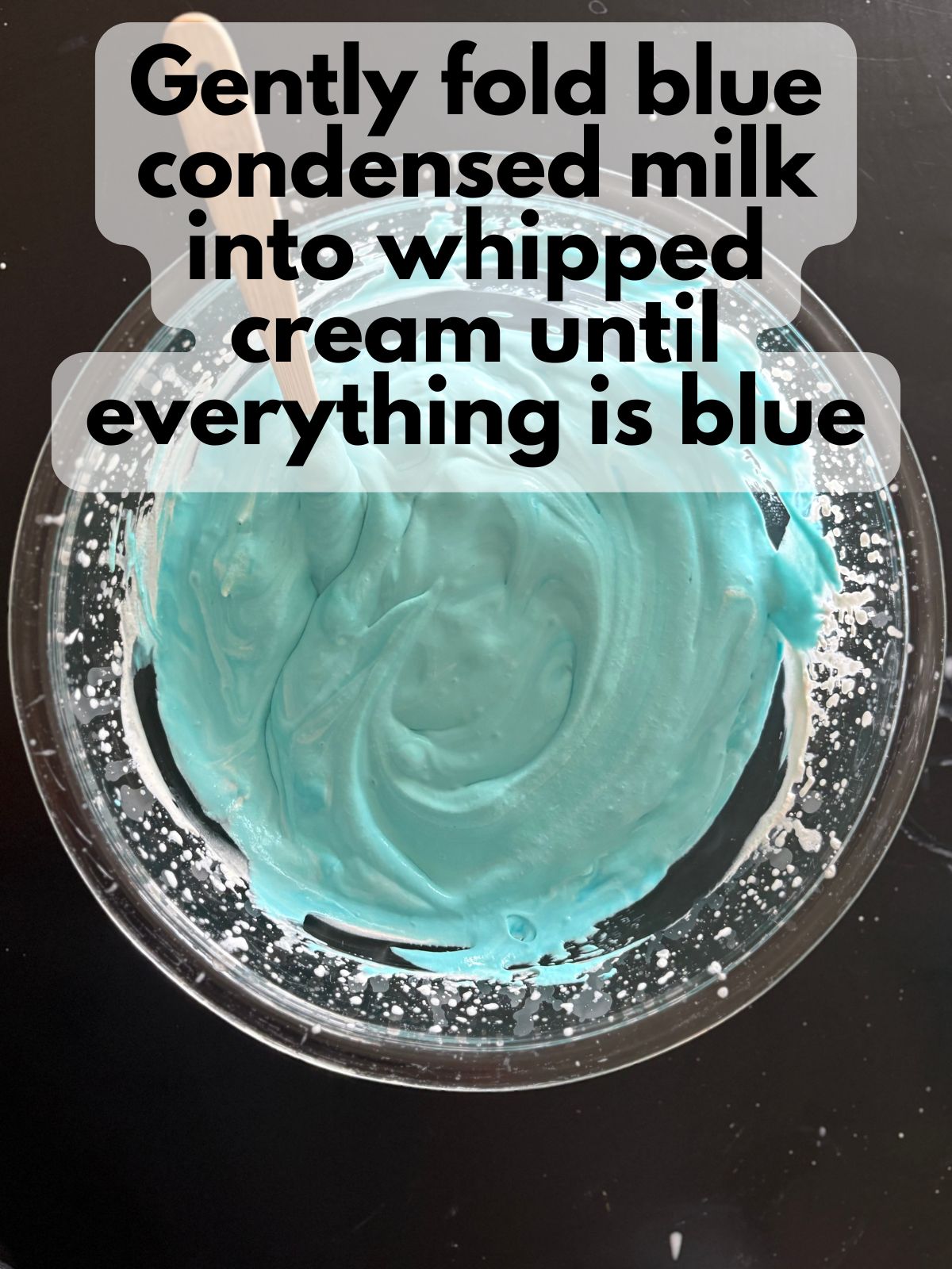 blue condensed milk folded into whipped cream