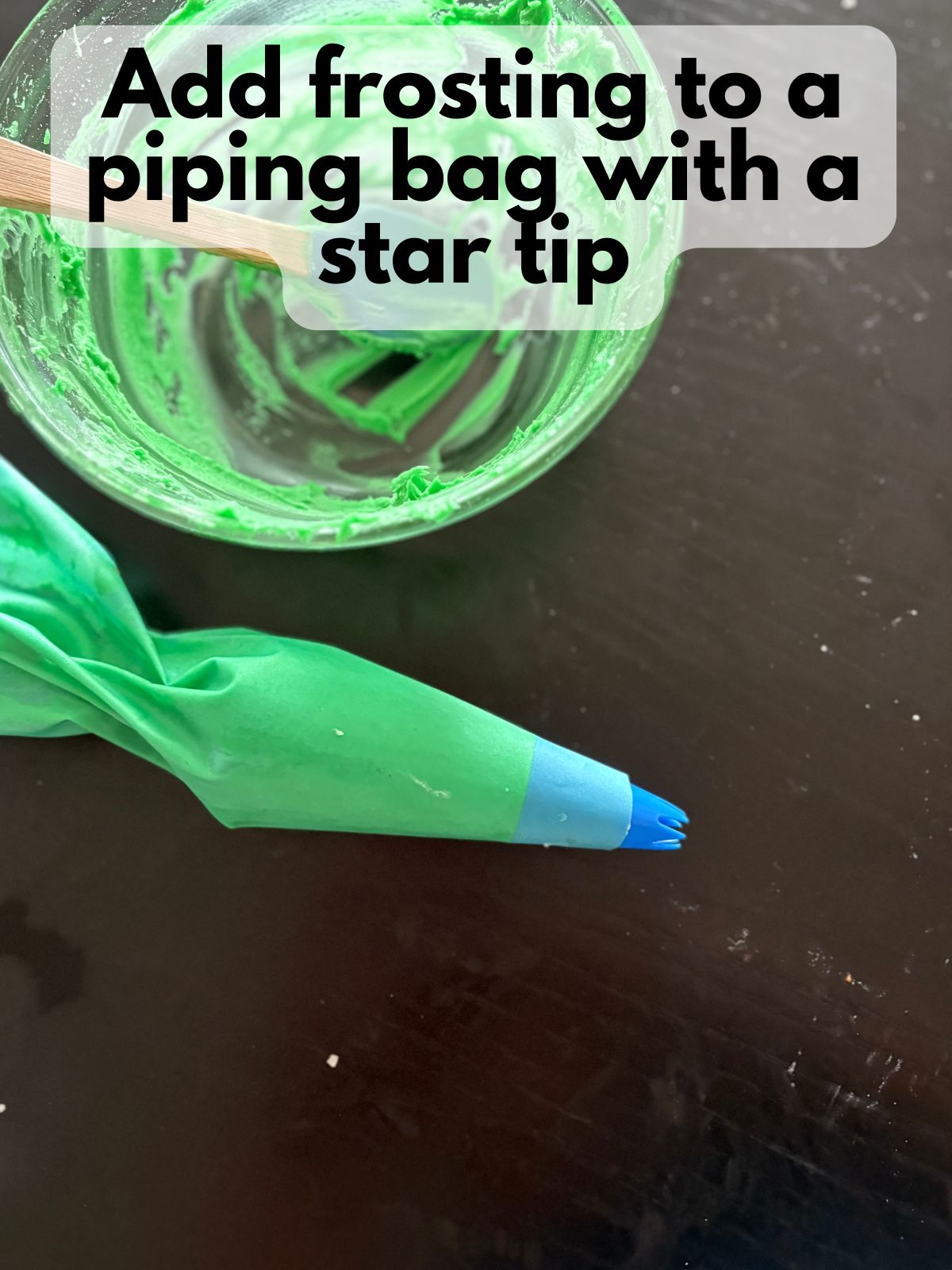 green frosting in a piping bag with a star tip