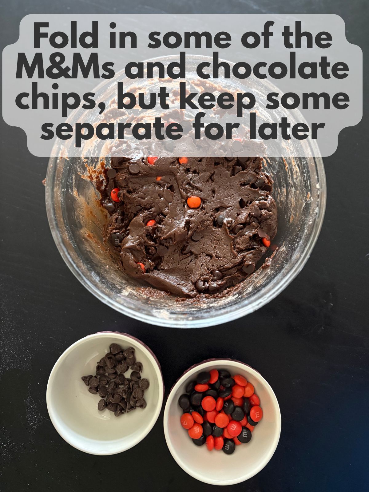 M&Ms and chocolate chips folded into chocolate cake mix cookie dough, some M&Ms and chocolate chips kept aside