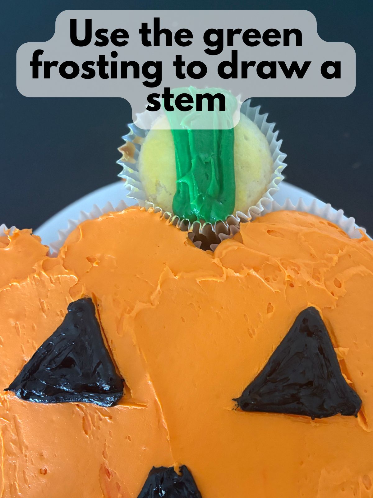 stem added to jack-o-lantern cupcake cake