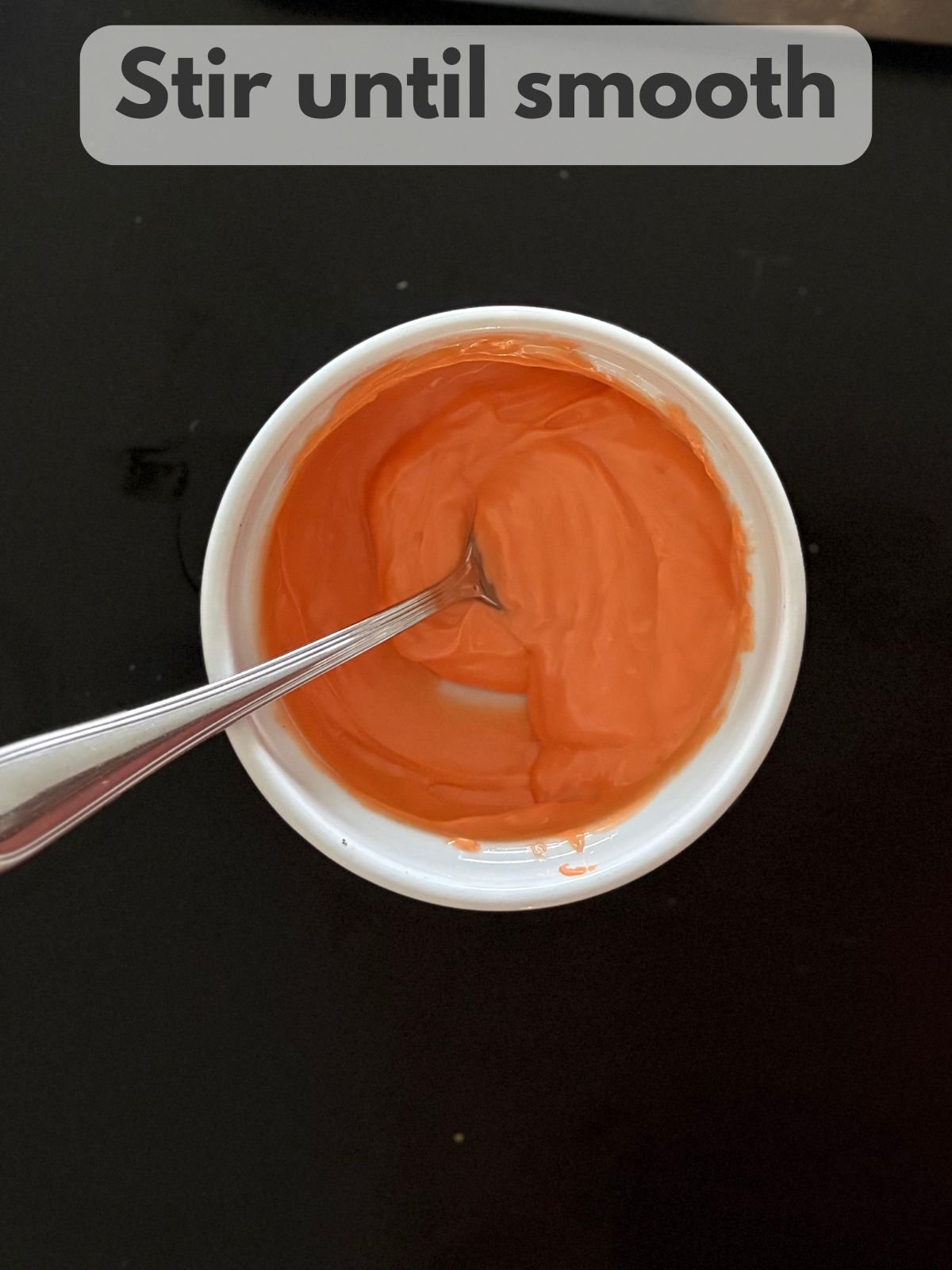 melted orange candy melts in a bowl