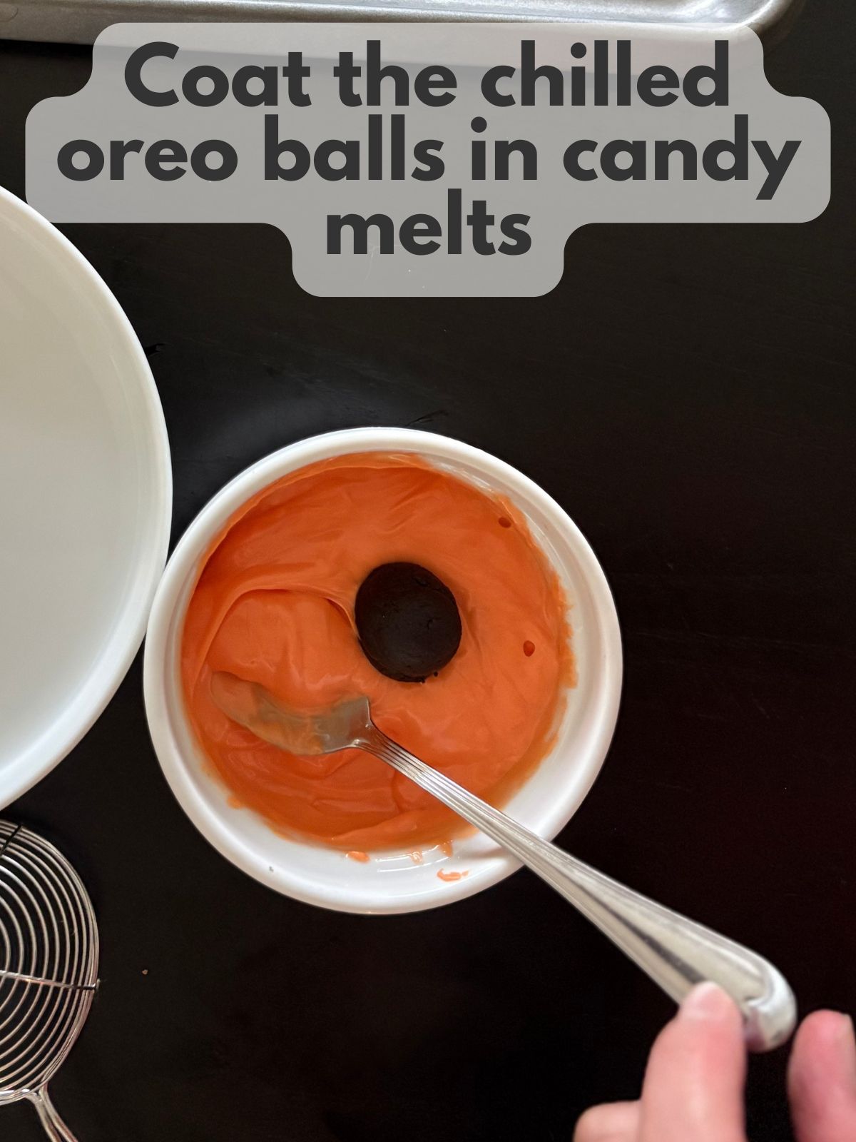oreo ball being coated in melted candy melts