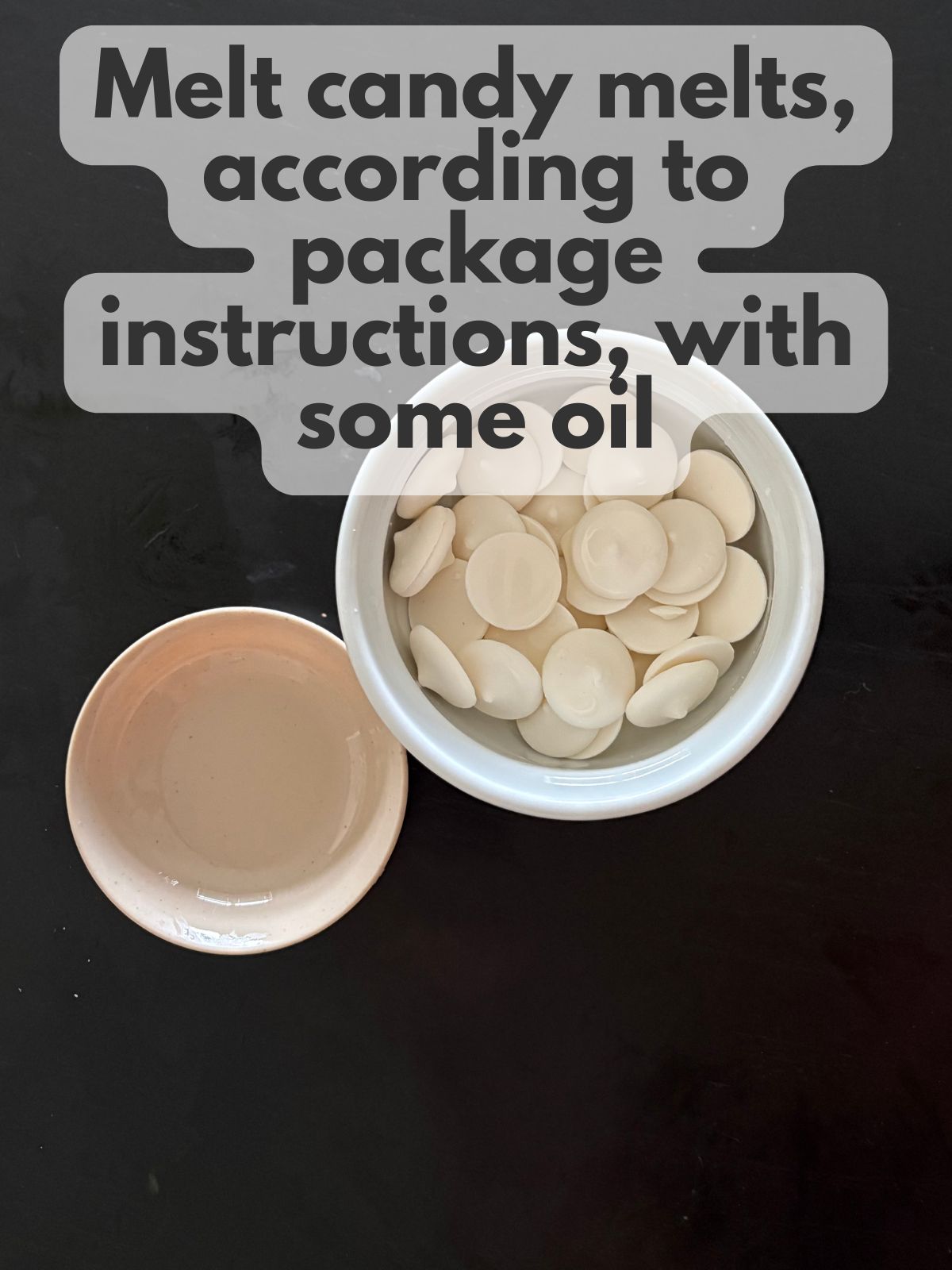 white candy melts in a bowl with oil