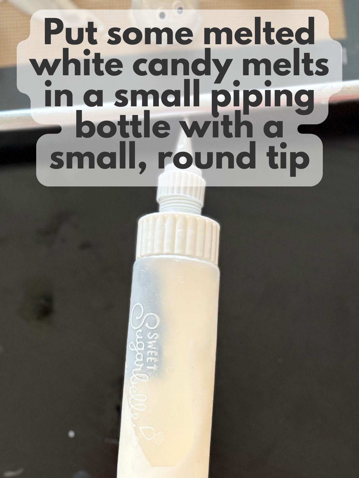 melted white candy melts in a small piping bottle