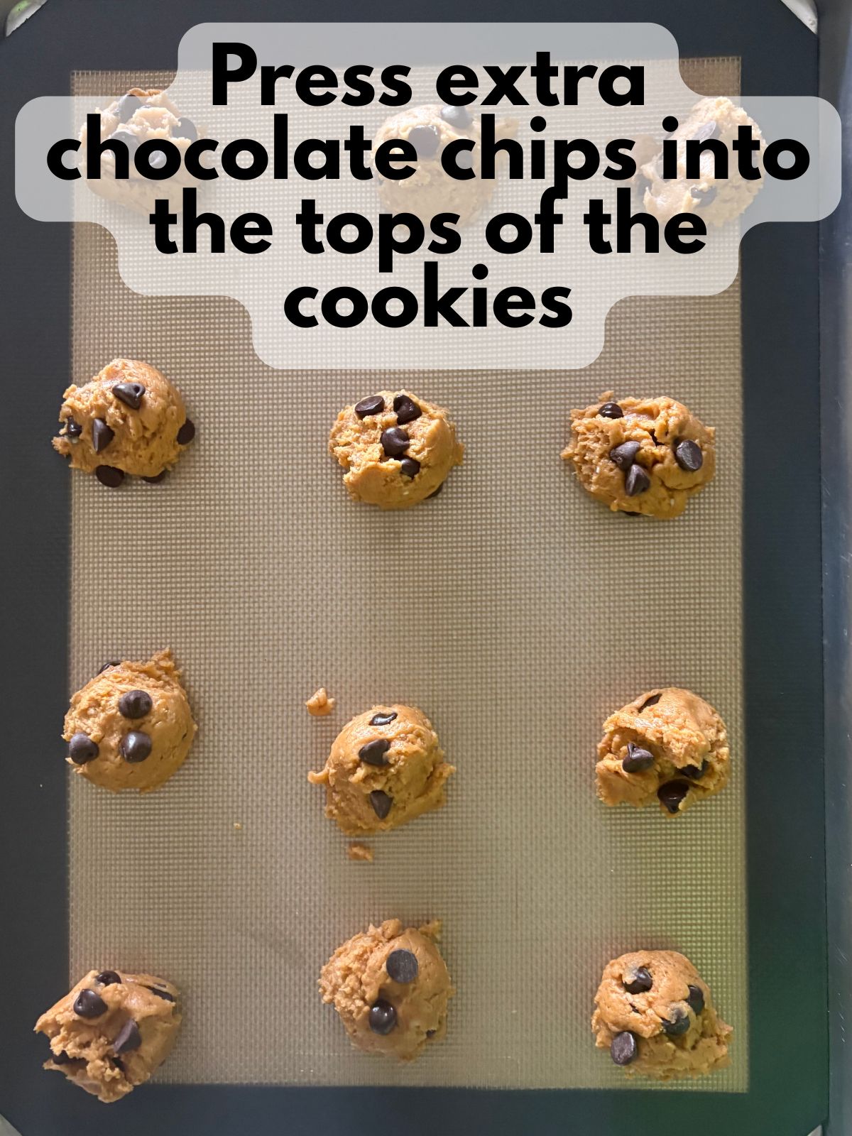 extra chocolate chips pressed into the tops of scooped cookie dough balls
