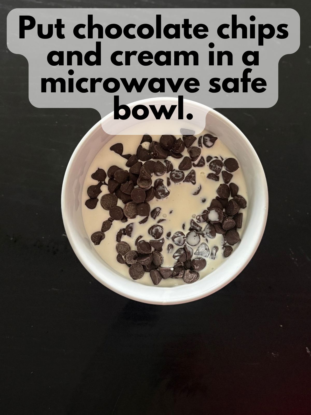 chocolate chips in a bowl with heavy cream