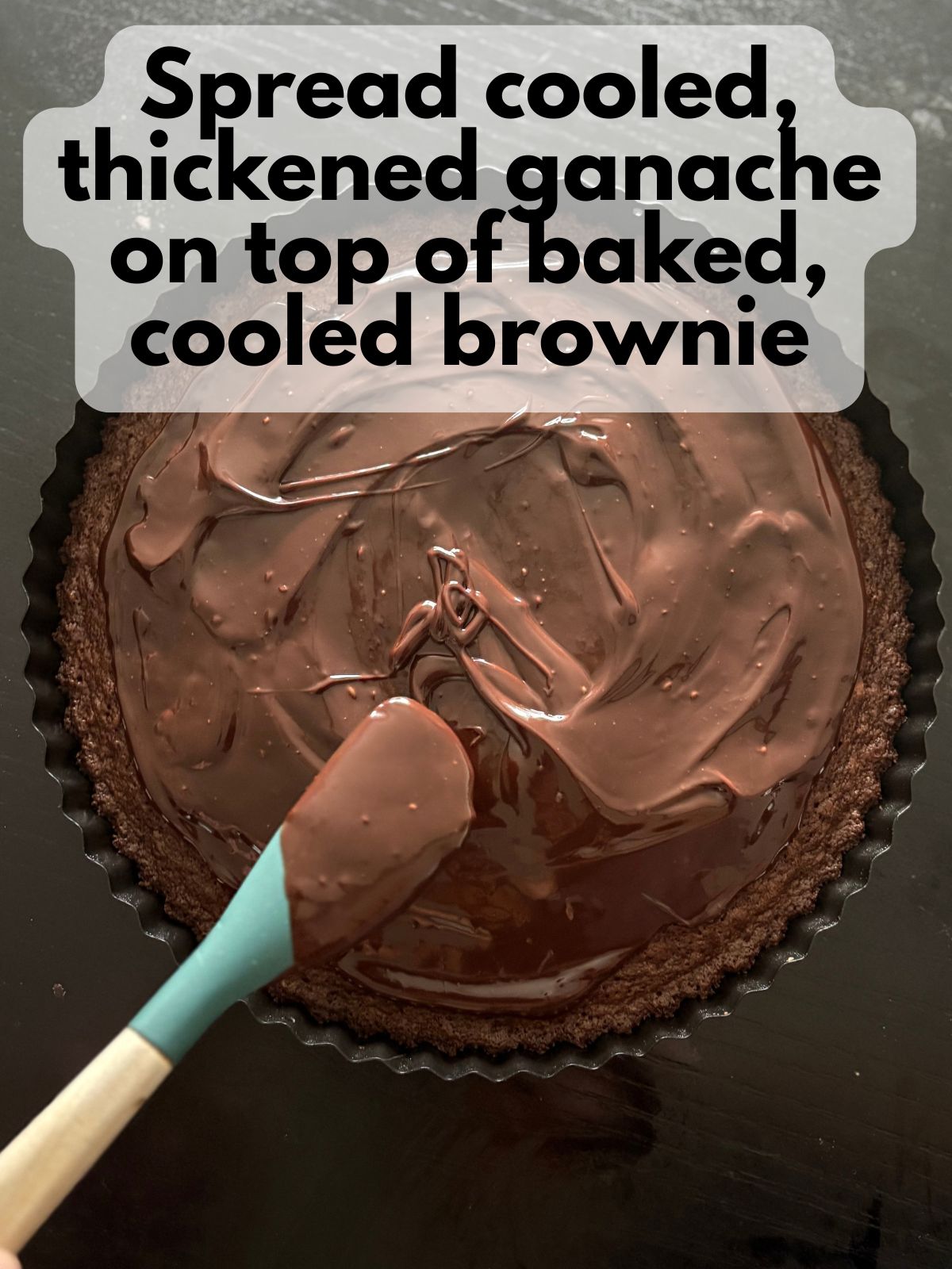 ganache spread on top of baked brownie