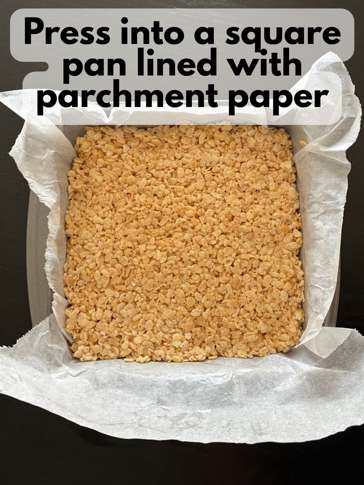 rice krispie treats pressed into a square pan