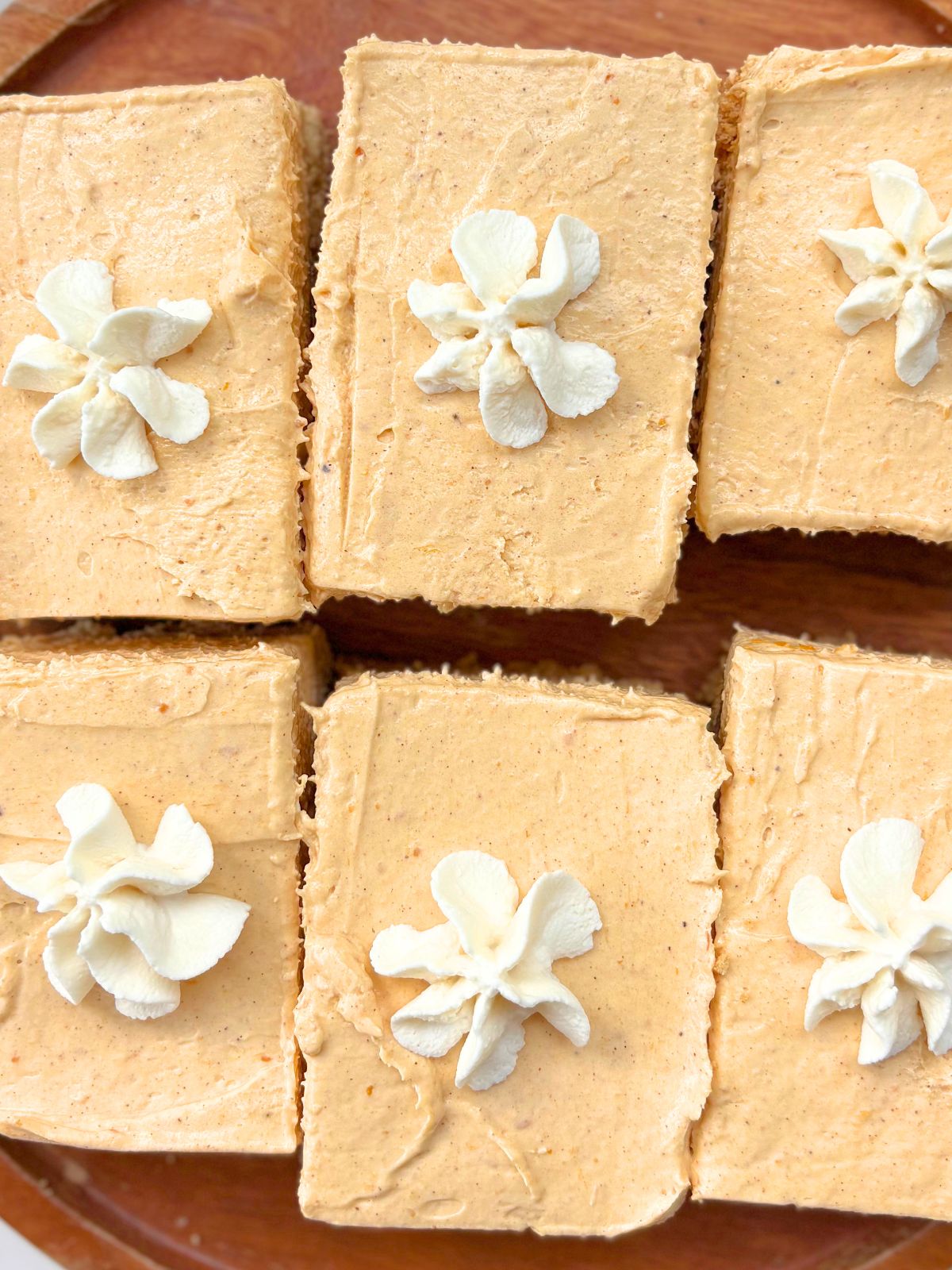 no bake pumpkin cheesecake bars on a tray