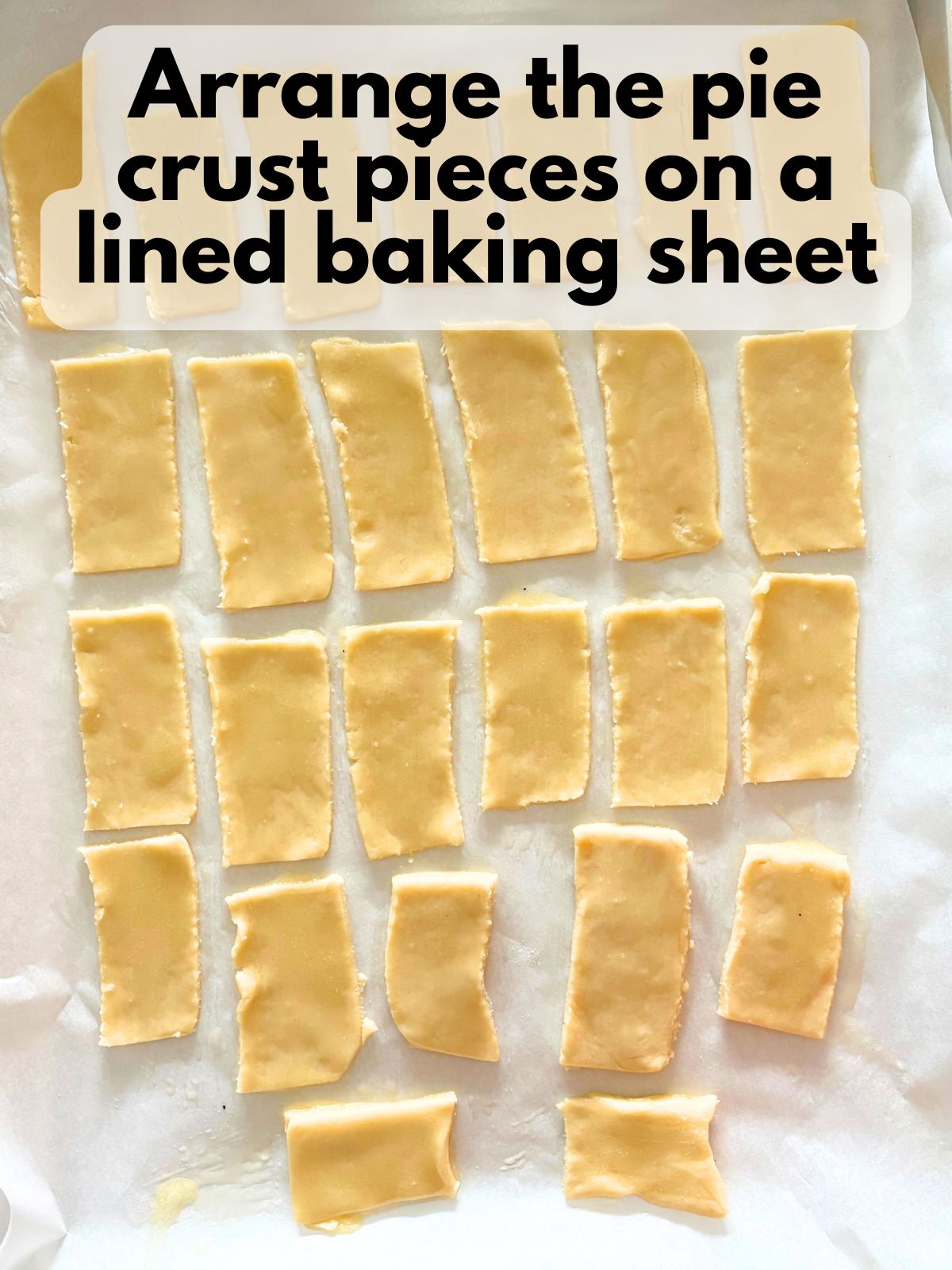 pie crust cut into rectangles on a lined baking sheet