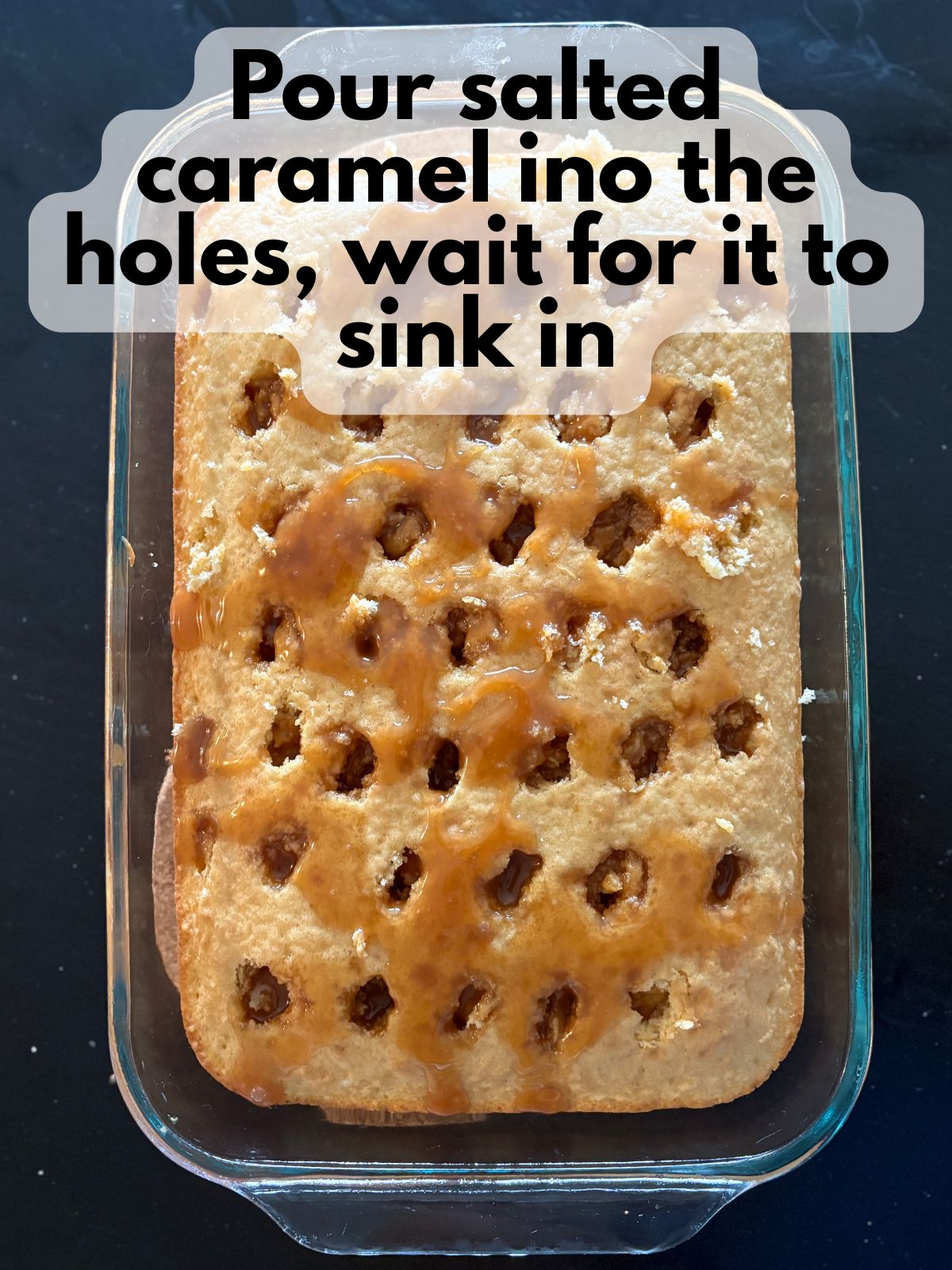 salted caramel drizzled over cake poked full of holes