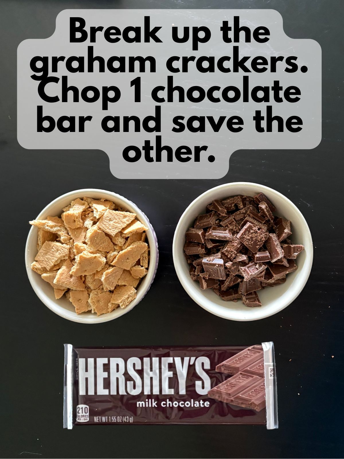roughly chopped graham crackers and chocolate bar, one chocolate bar left whole